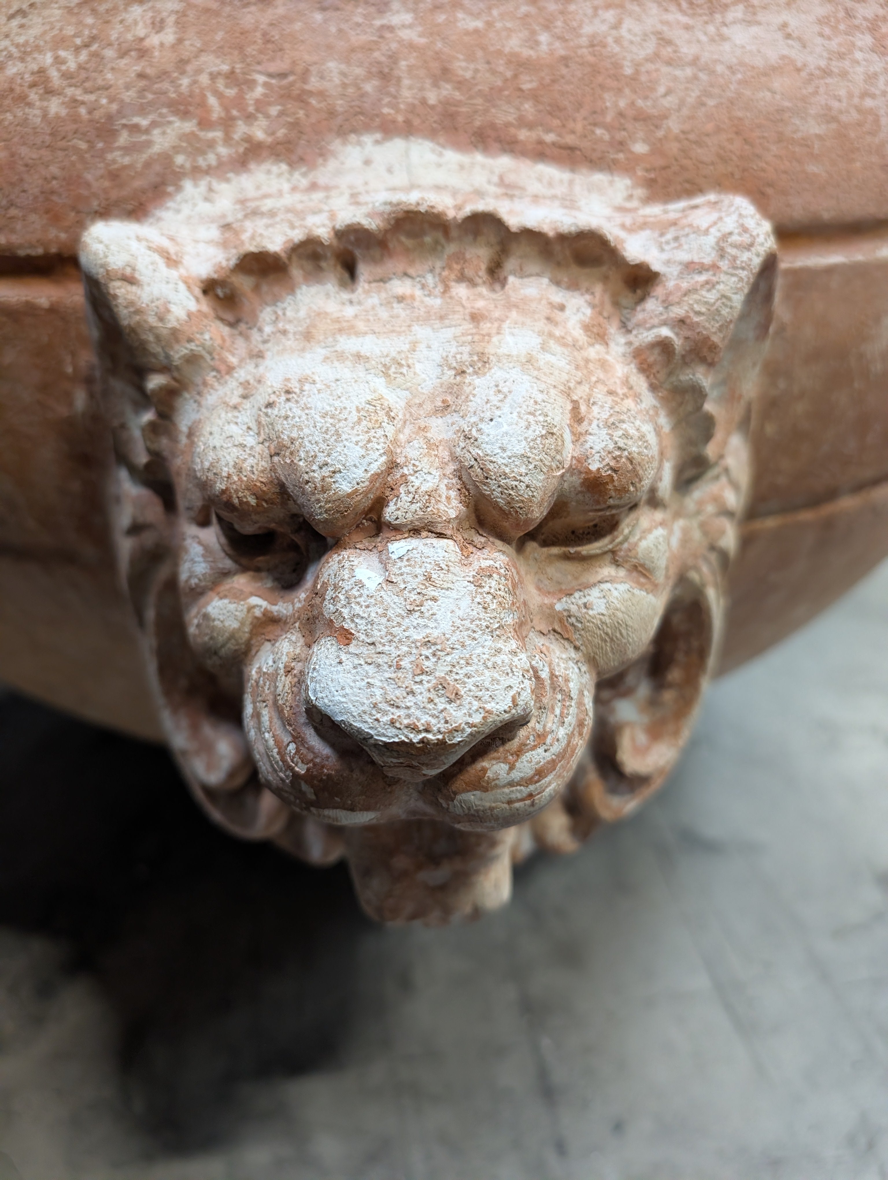 Ornate Terracotta-Style Planter with Lion Head Accents