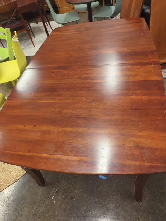 Wood dining table with two leaves