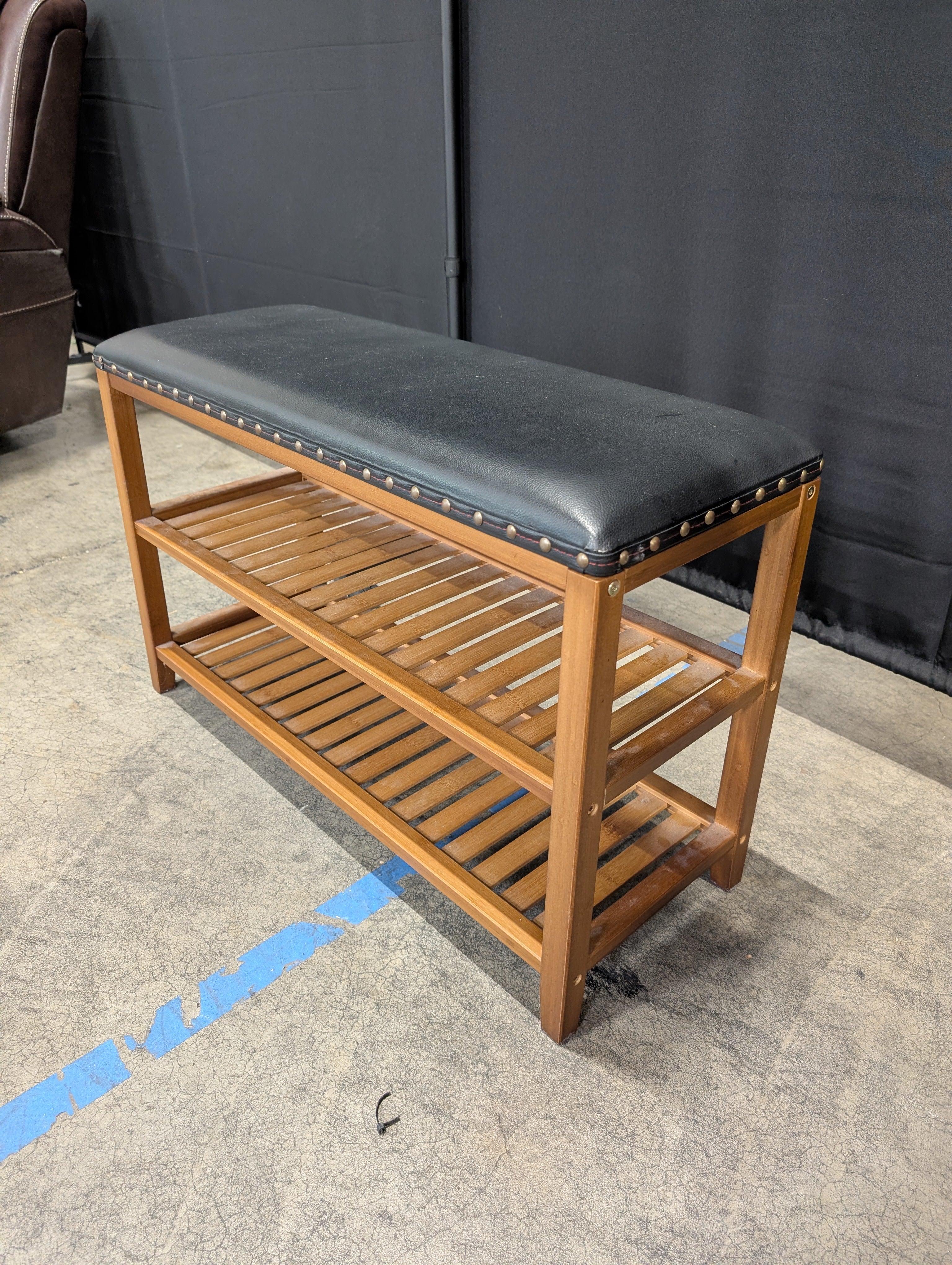 Hardwood Entryway Bench with Padded Black Upholstery and Slatted Shelves