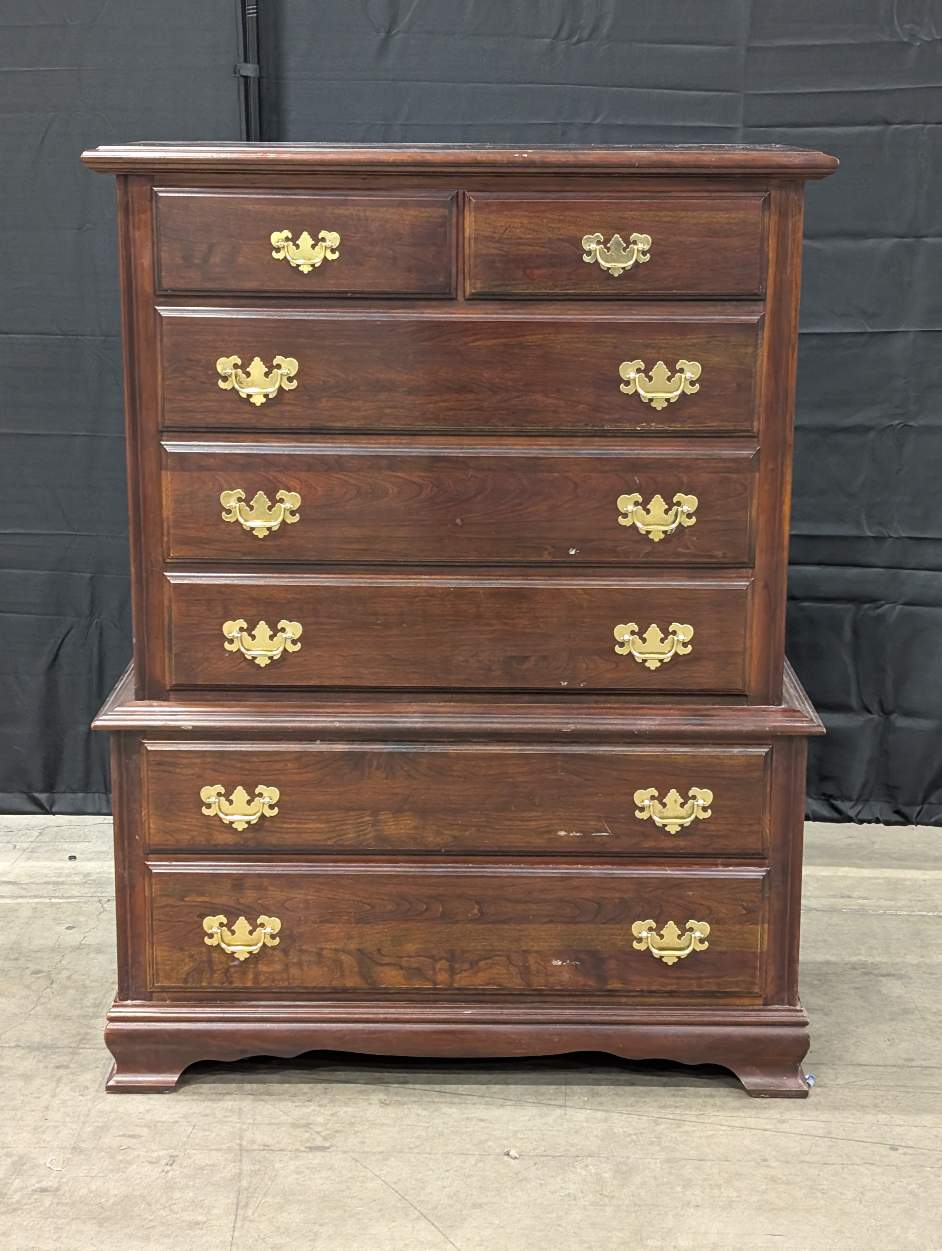Traditional Dark Wood Chest of Drawers with Ornate Brass Pulls