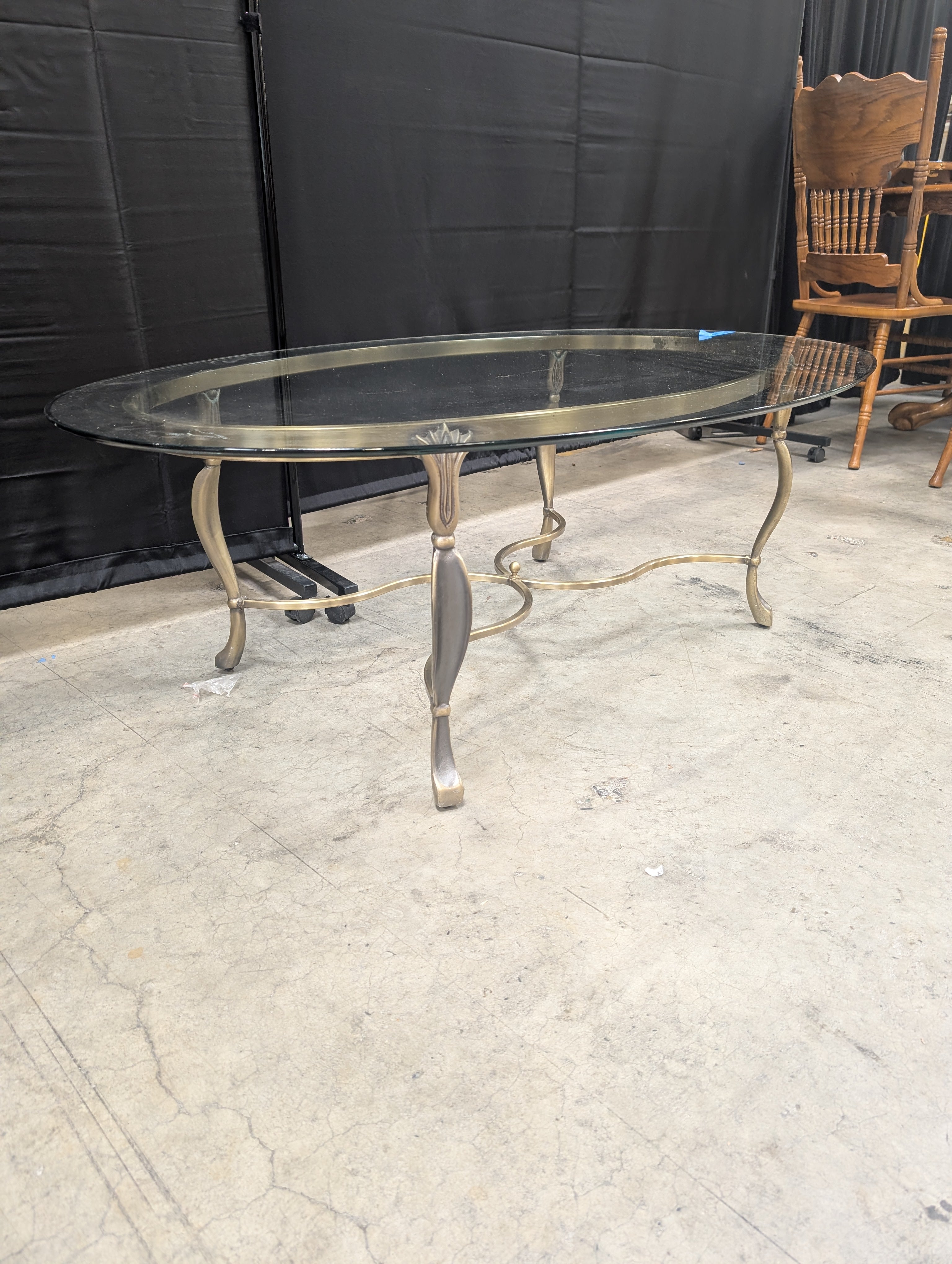 Ornate Brass-Toned Oval Coffee Table with Glass Top