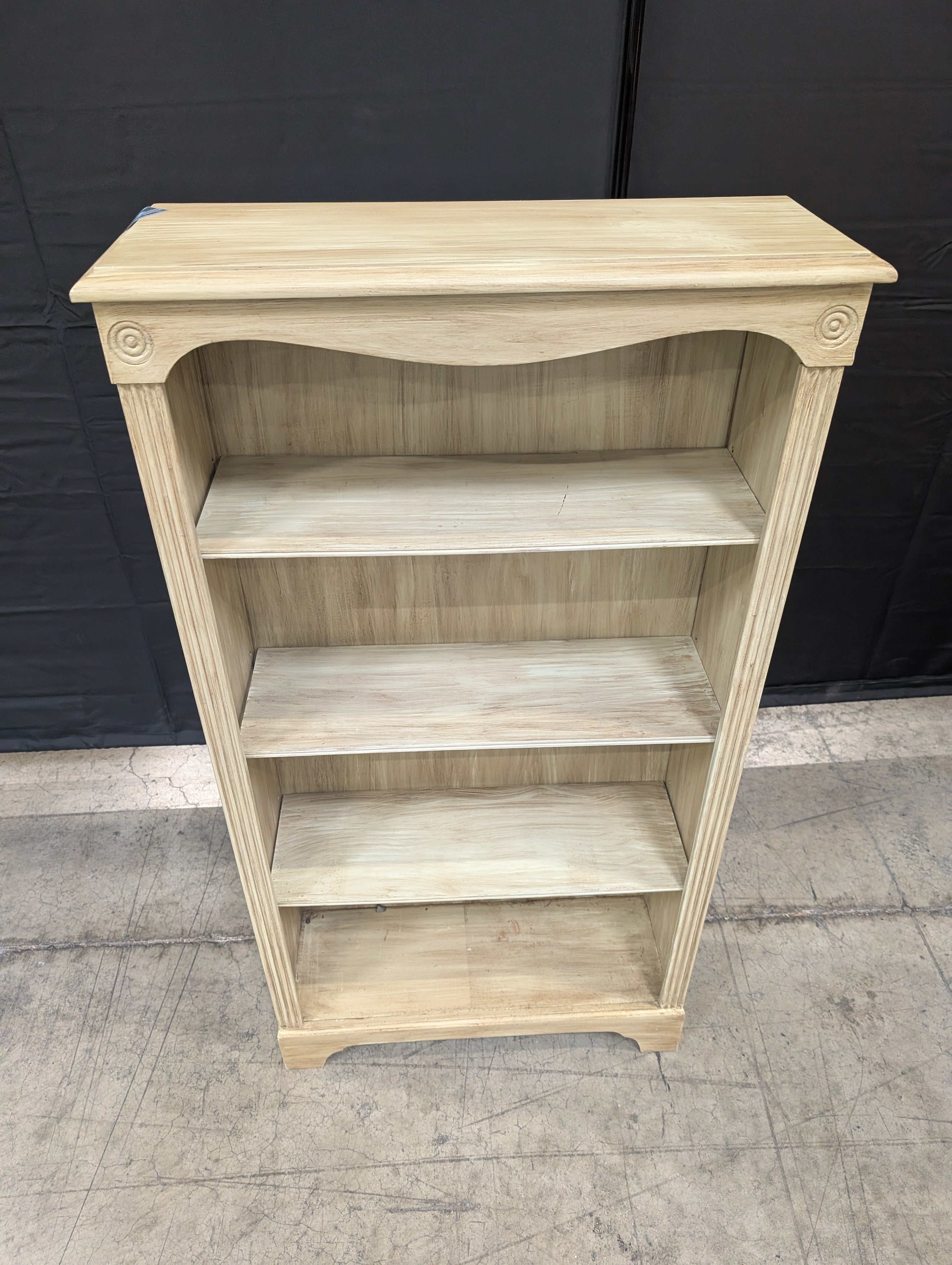 Light Wood Tone Four-Shelf Bookcase with Arched Detail