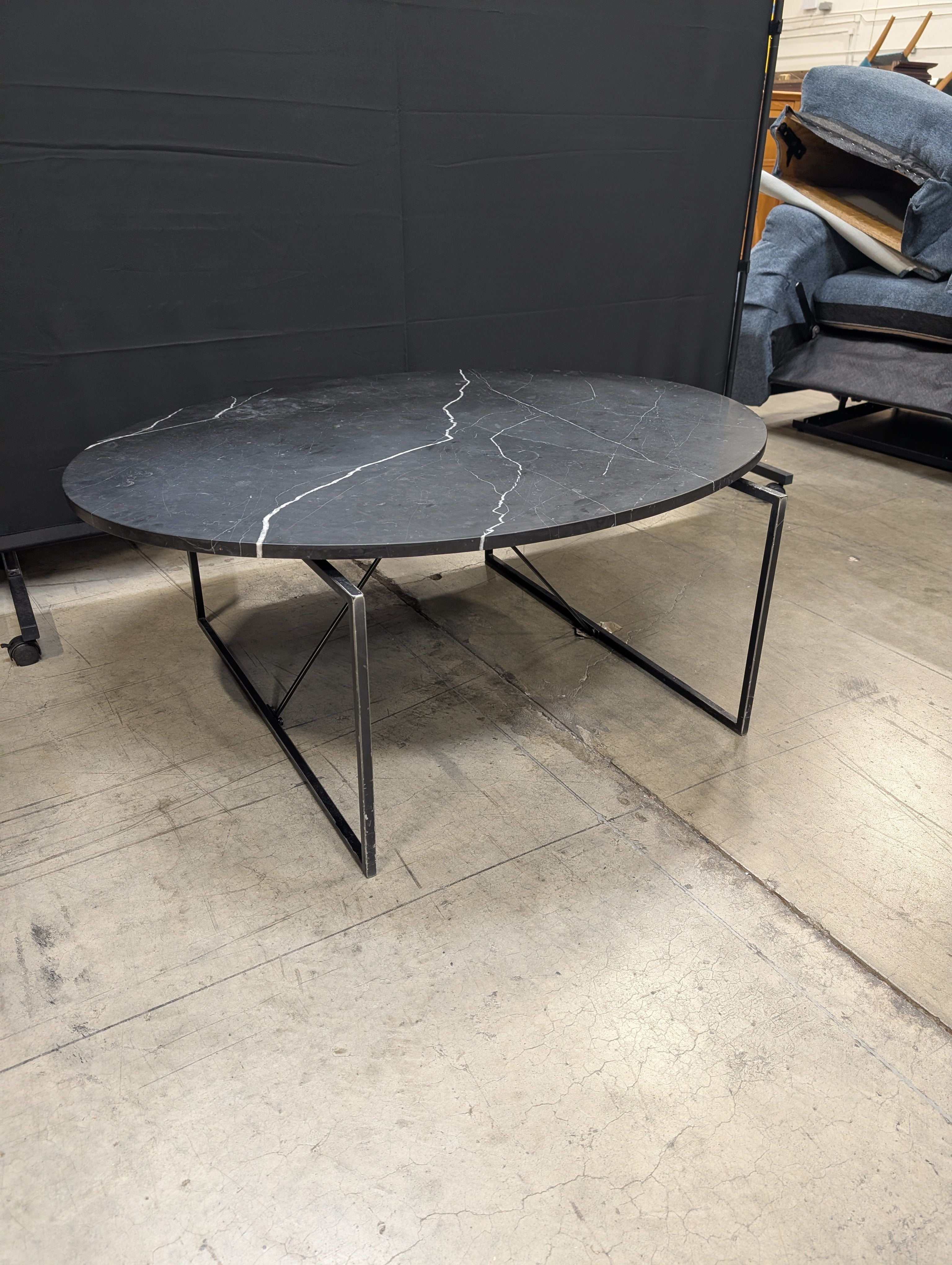 Modern Oval Stone Top Coffee Table with Geometric Metal Base