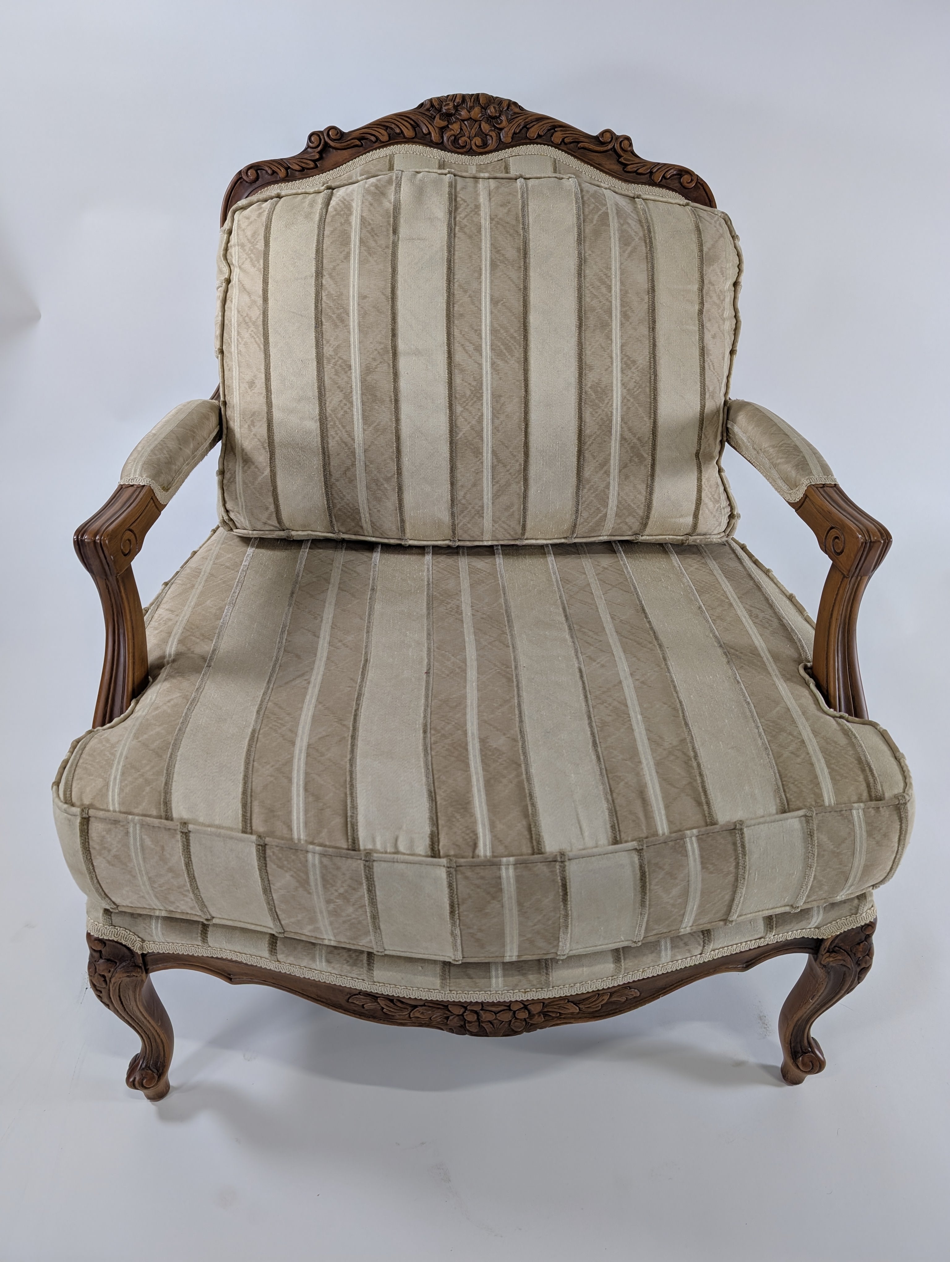 Ornate Carved Wood Armchair with Striped Upholstery