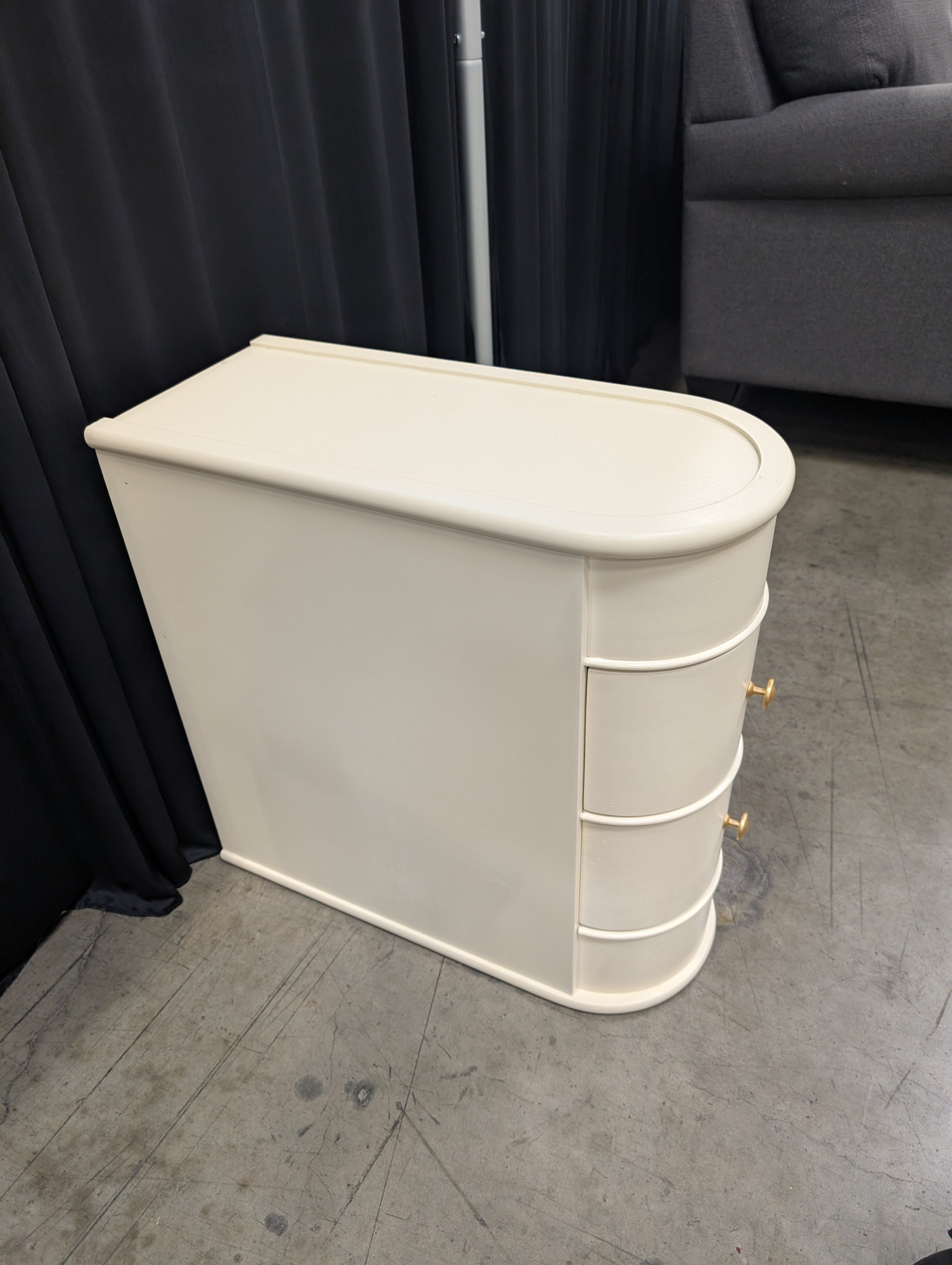 Cream Curved Two-Drawer Nightstand with Gold Knob