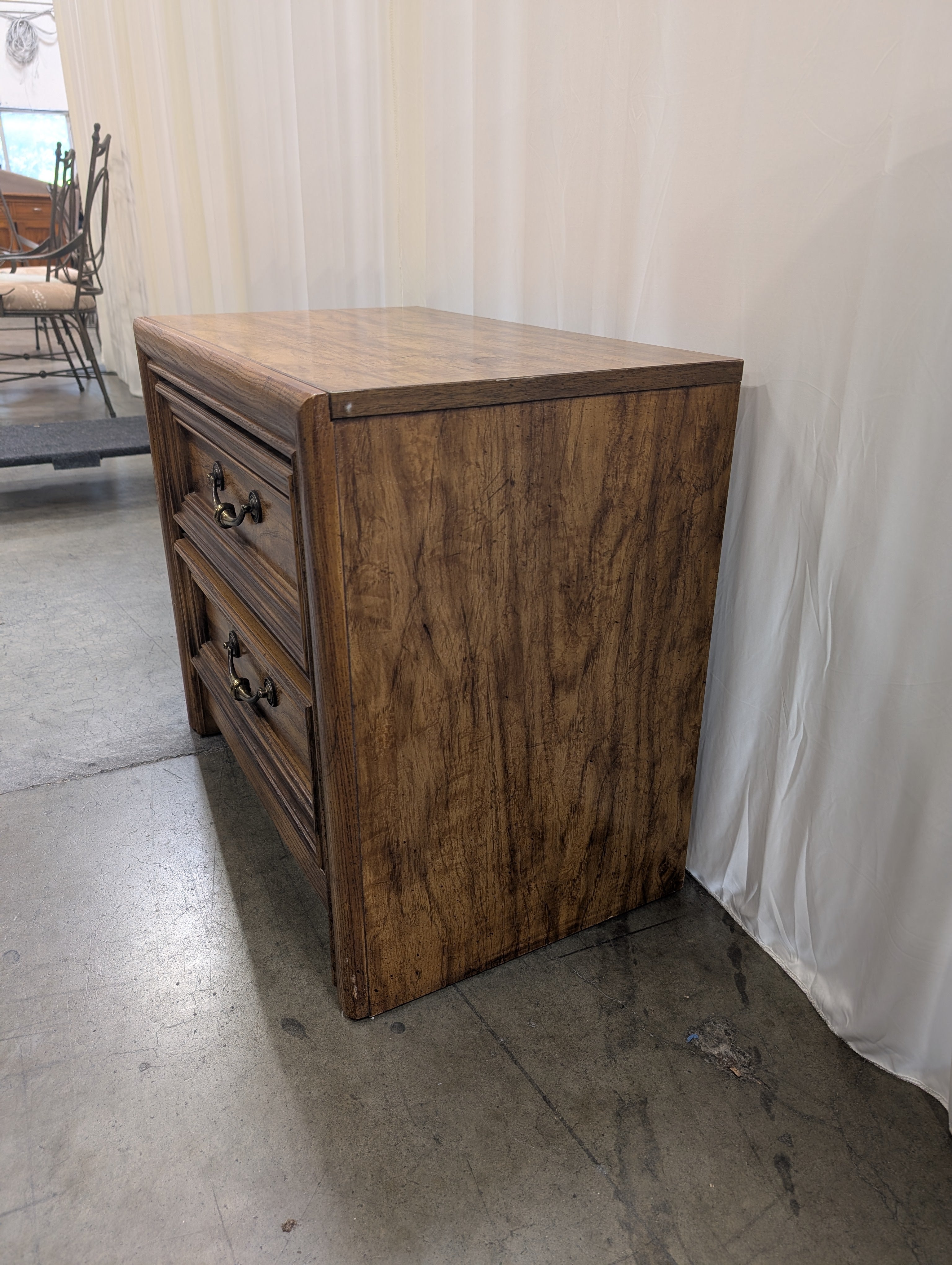 Warm Brown Wood Two-Drawer Nightstand with Ornate Hardware