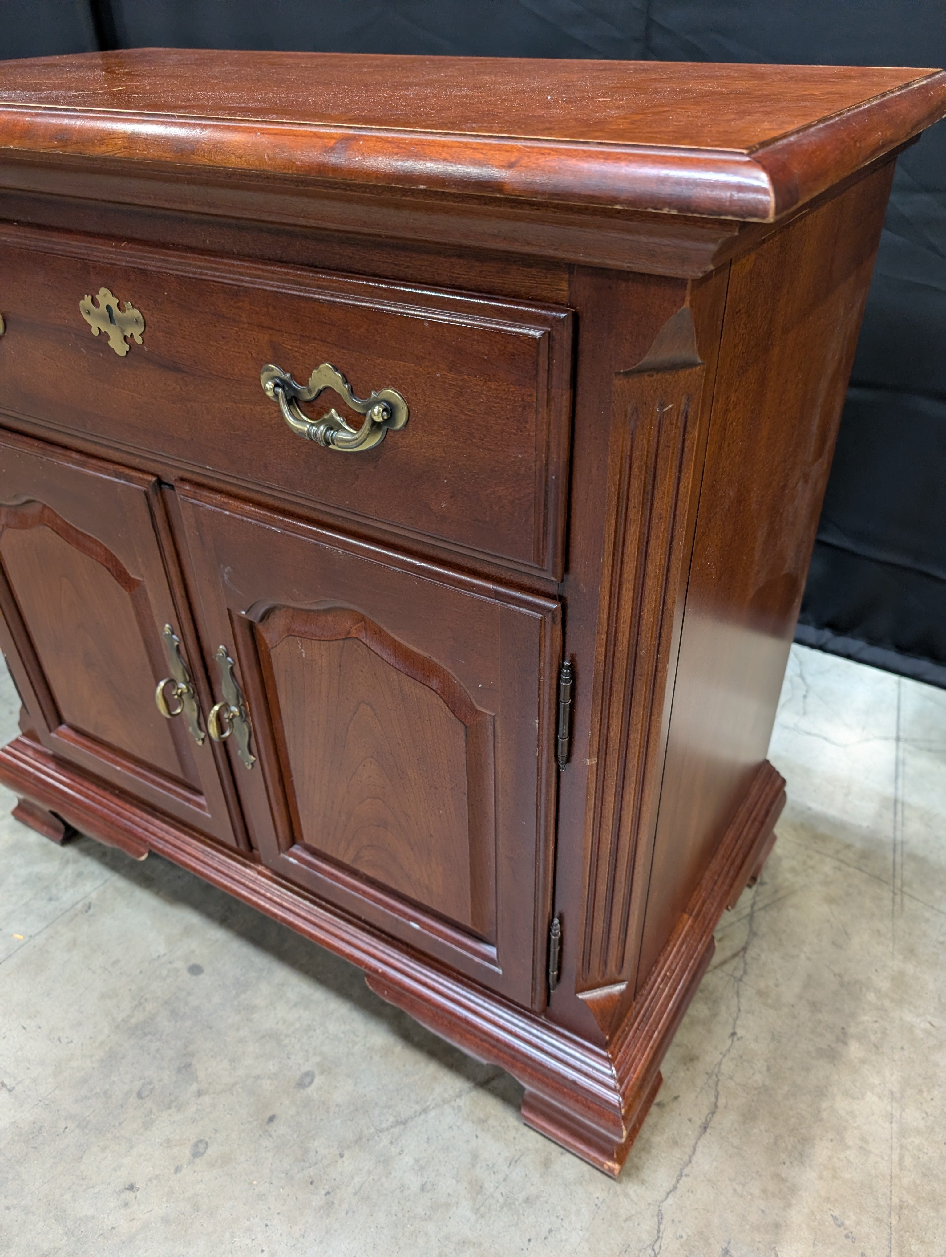 Traditional Reddish Brown Wood Accent Cabinet with Ornate Hardware