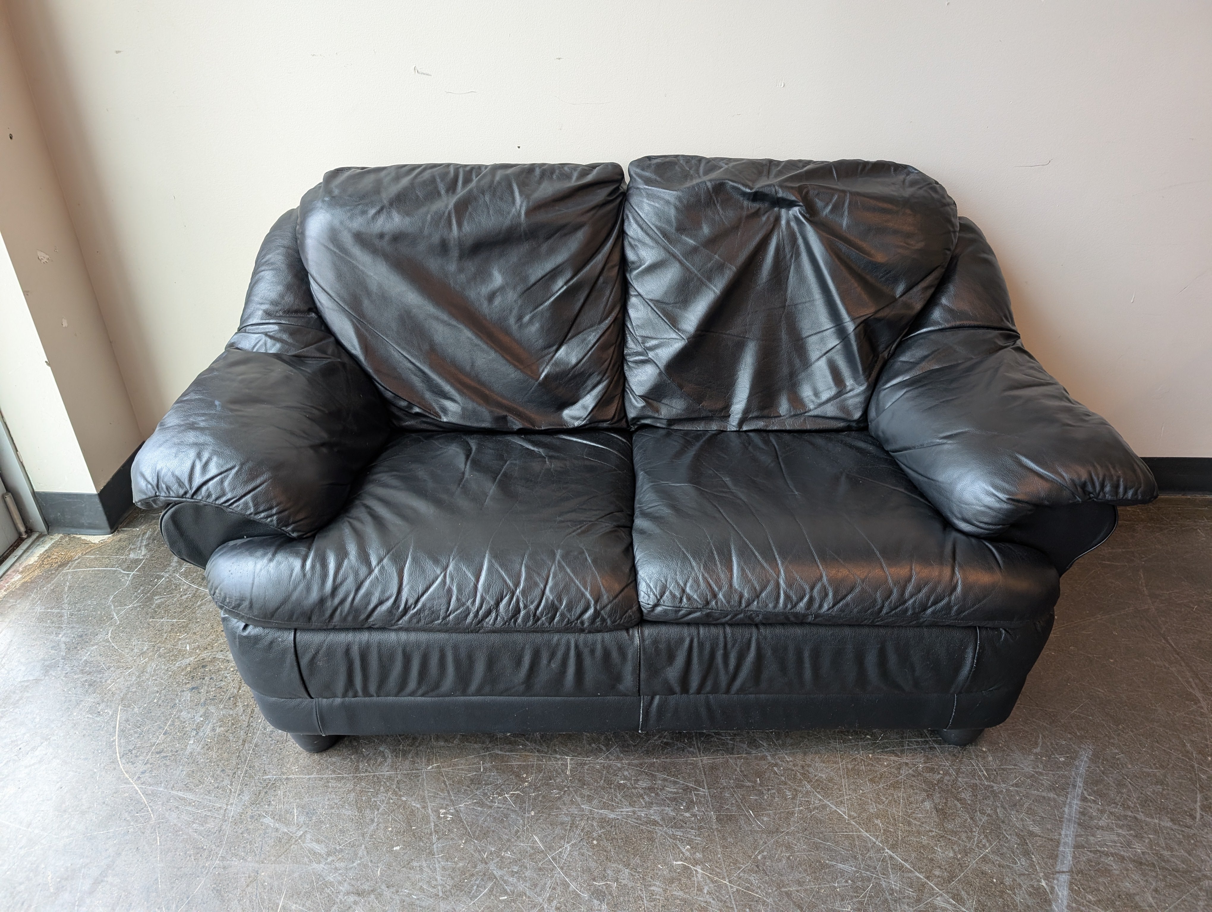 Spacious Black Leather Loveseat
