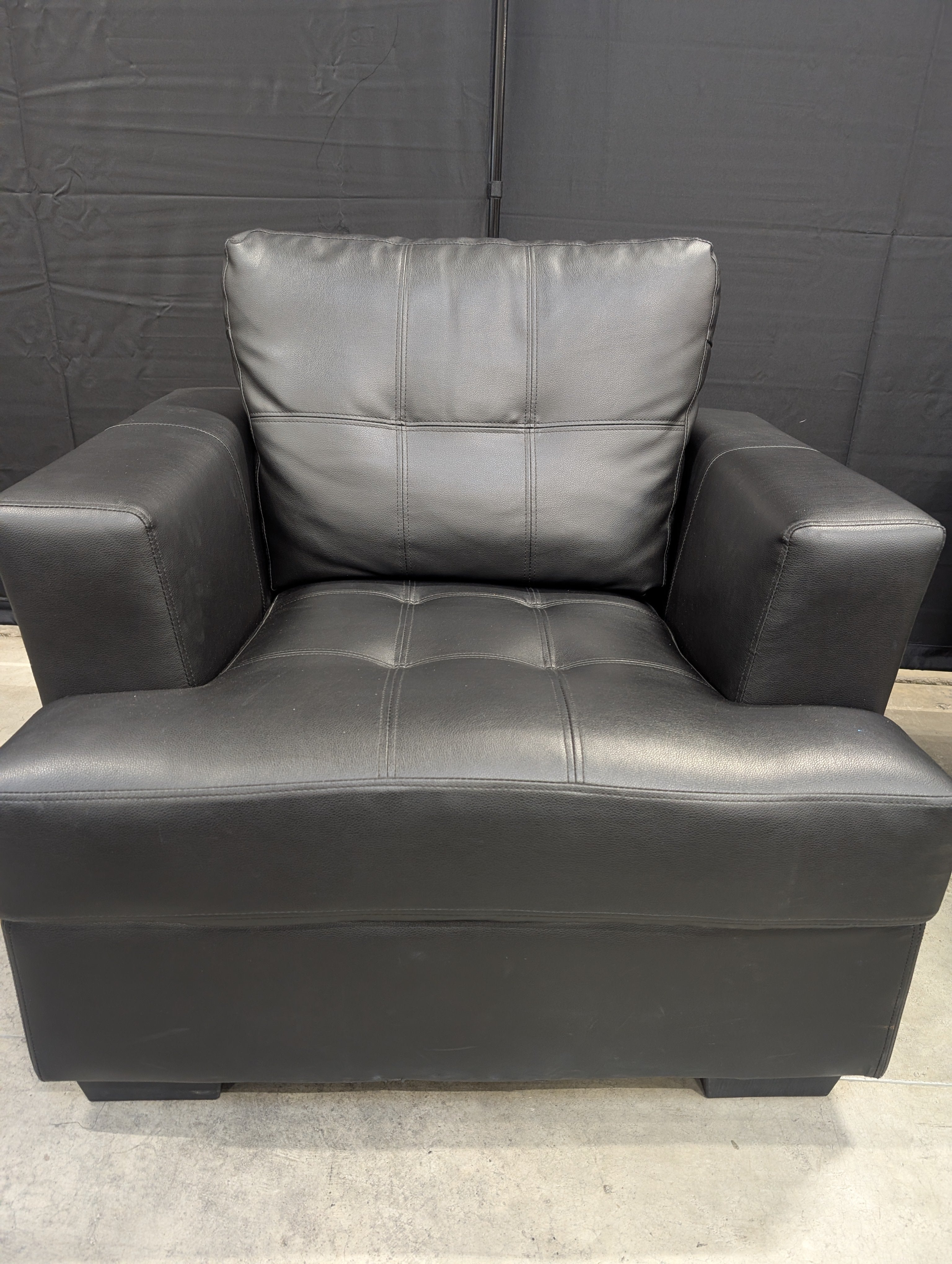 Contemporary Black Armchair with Tufted Cushions