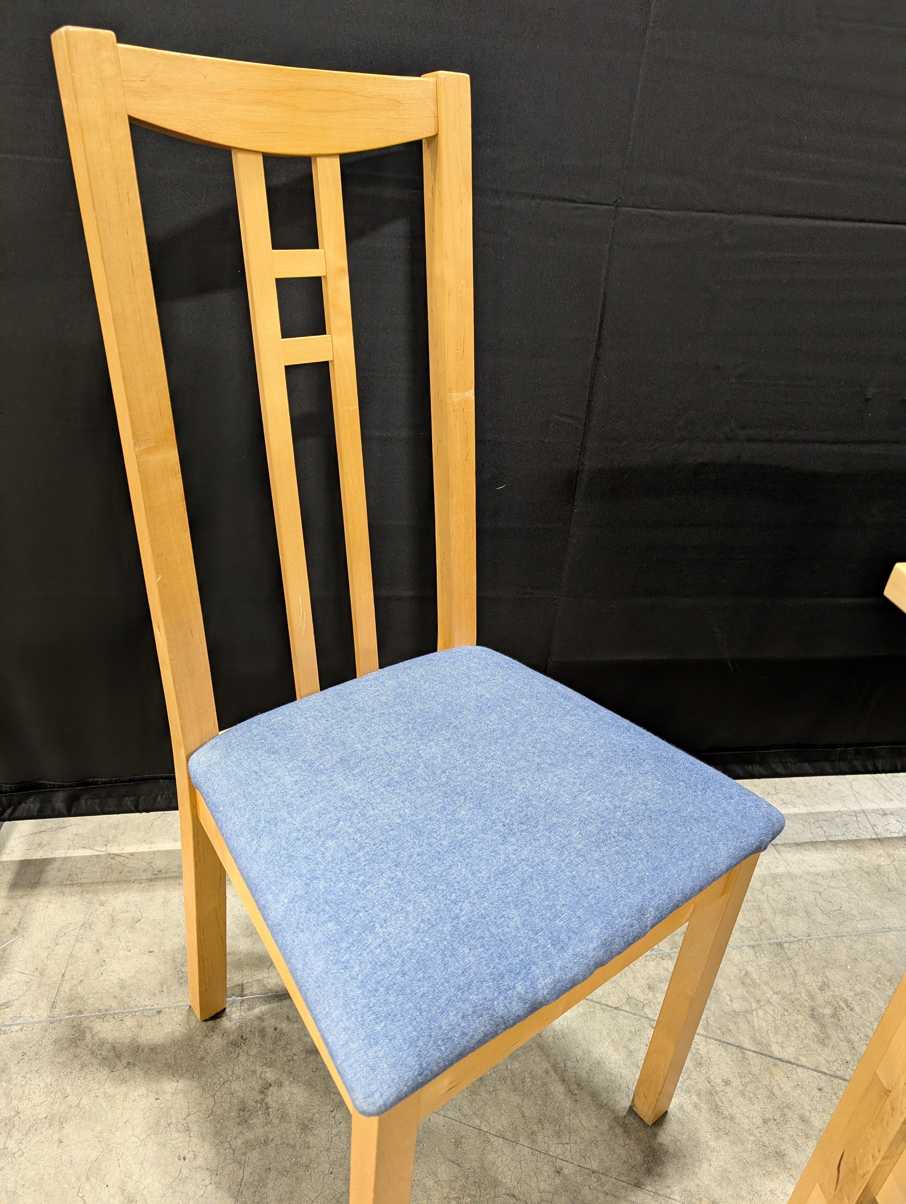 Versatile Extendable Light Wood Dining Table with Six Blue Upholstered Chairs