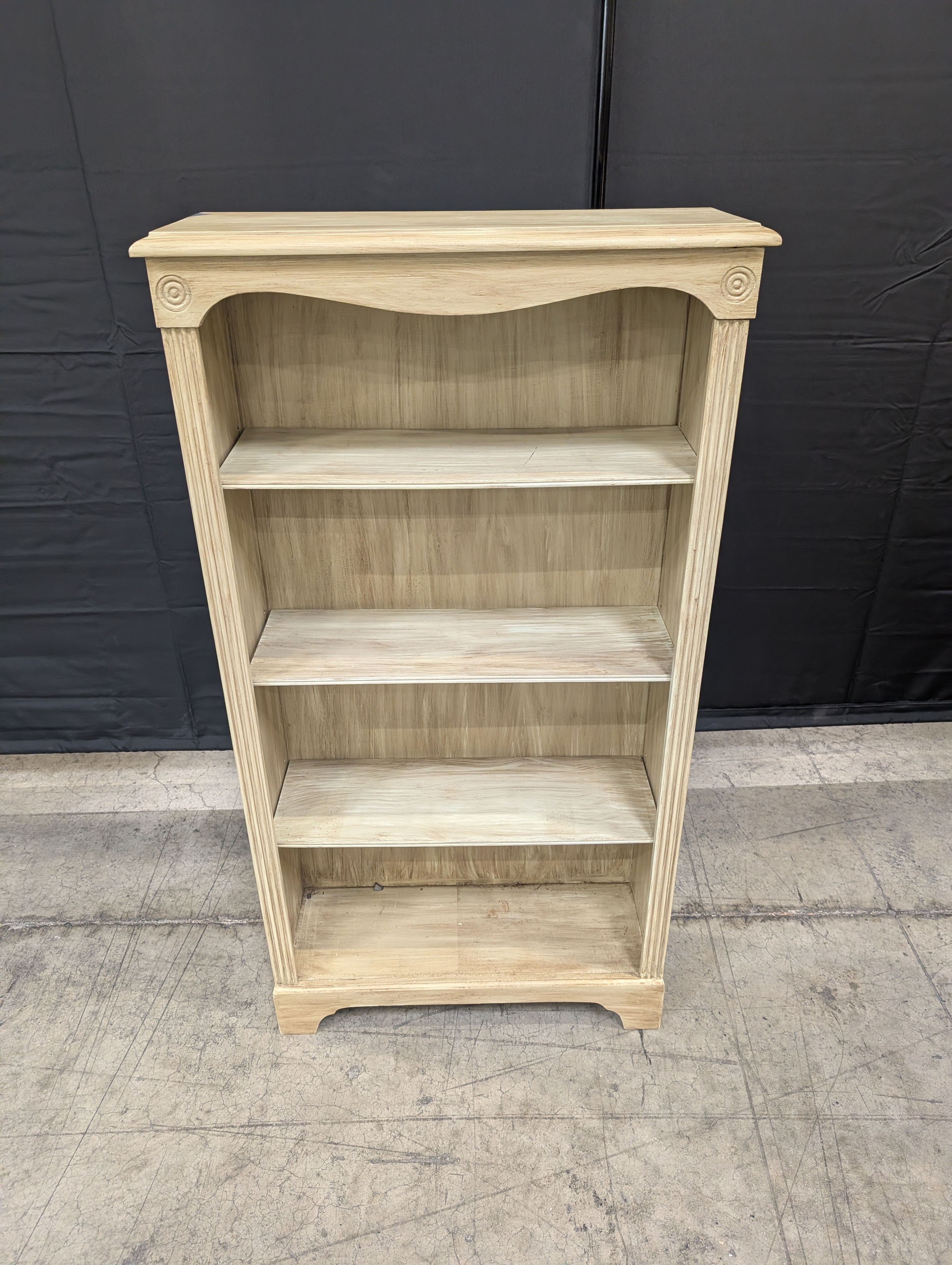 Light Wood Tone Four-Shelf Bookcase with Arched Detail