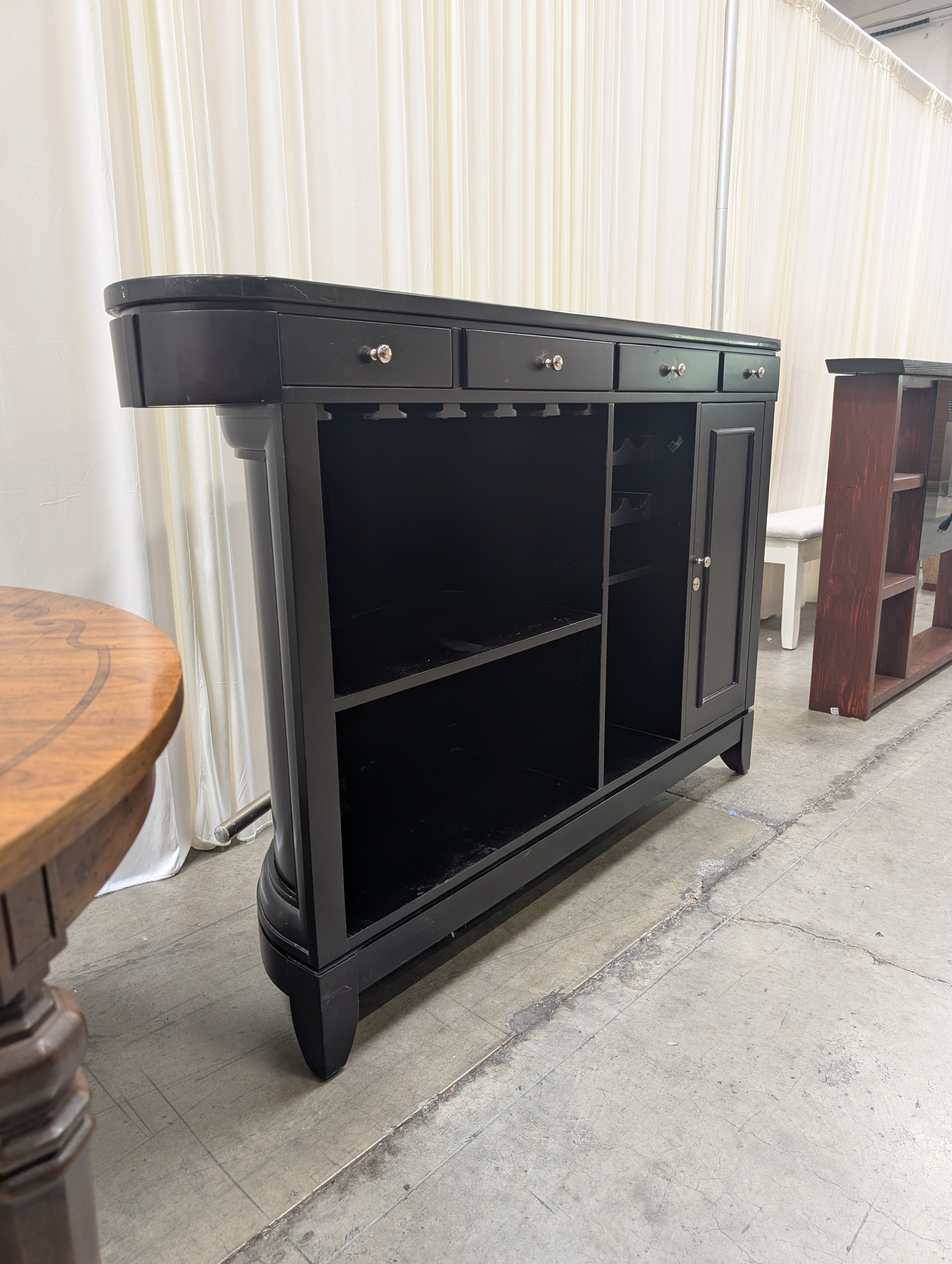 Dark Curved Wood Home Bar with Metal Foot Rail