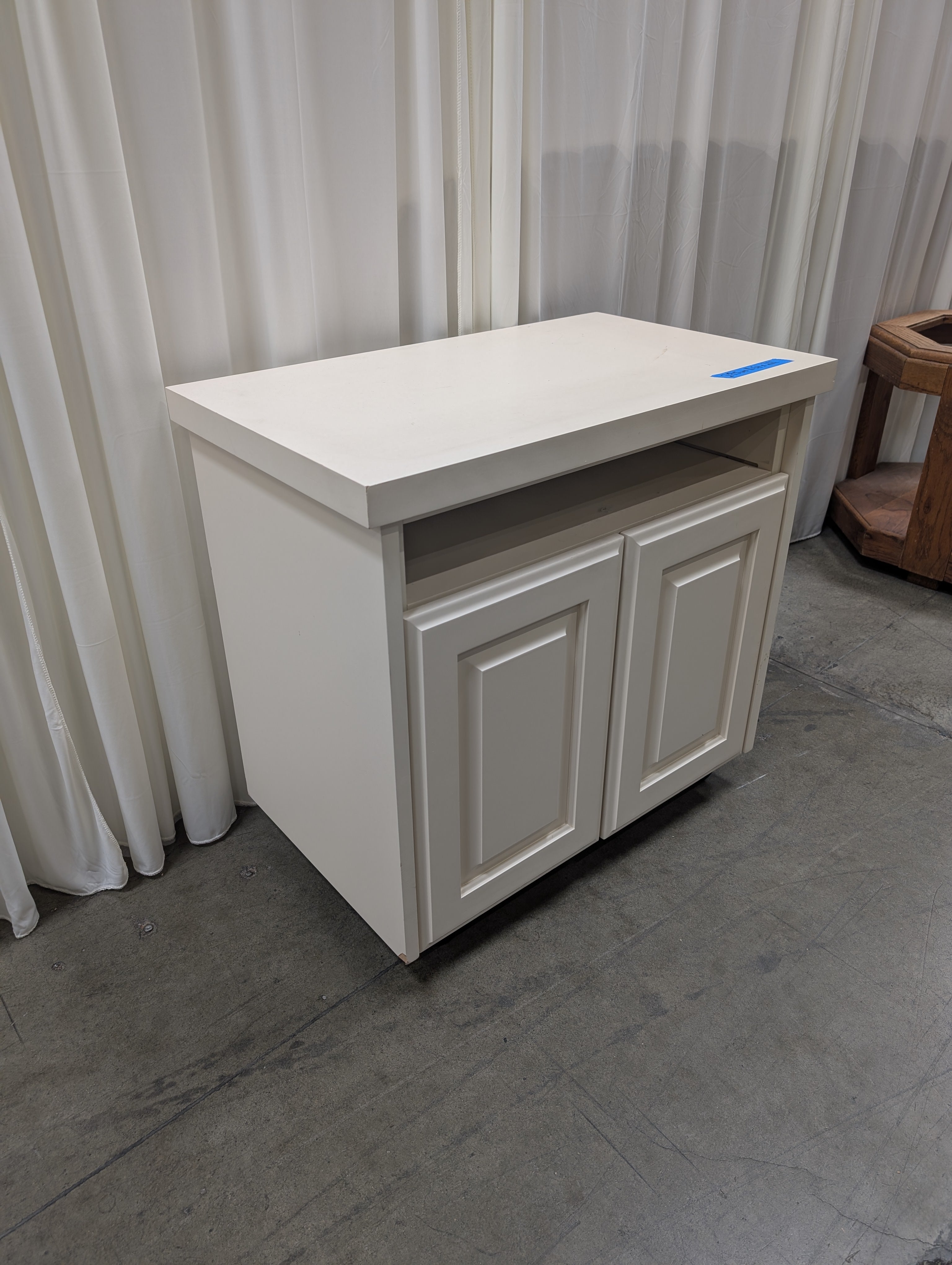 White Wood Two-Door TV Stand with Open Shelf