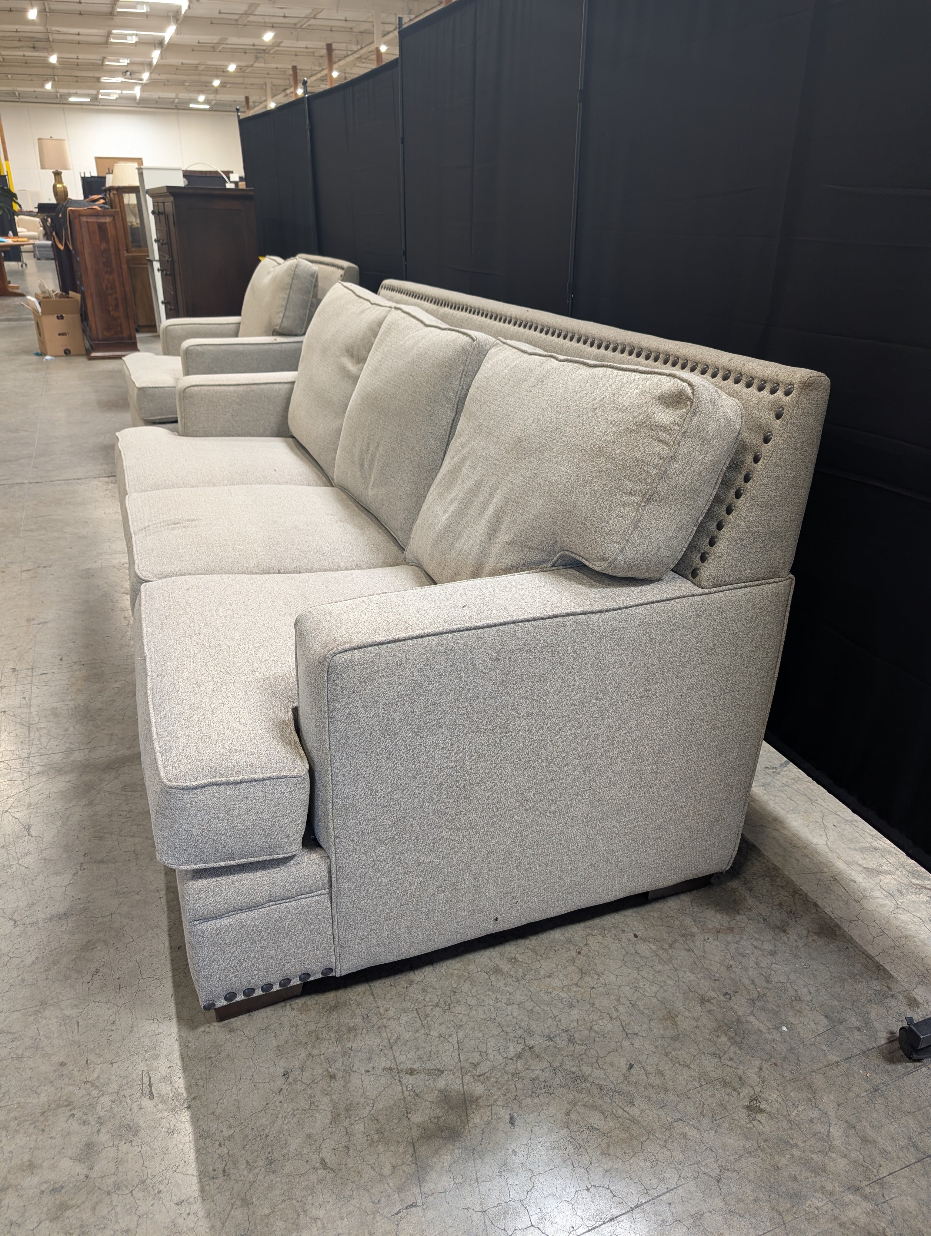 Grey Fabric Three-Seat Couch with Nailhead Trim