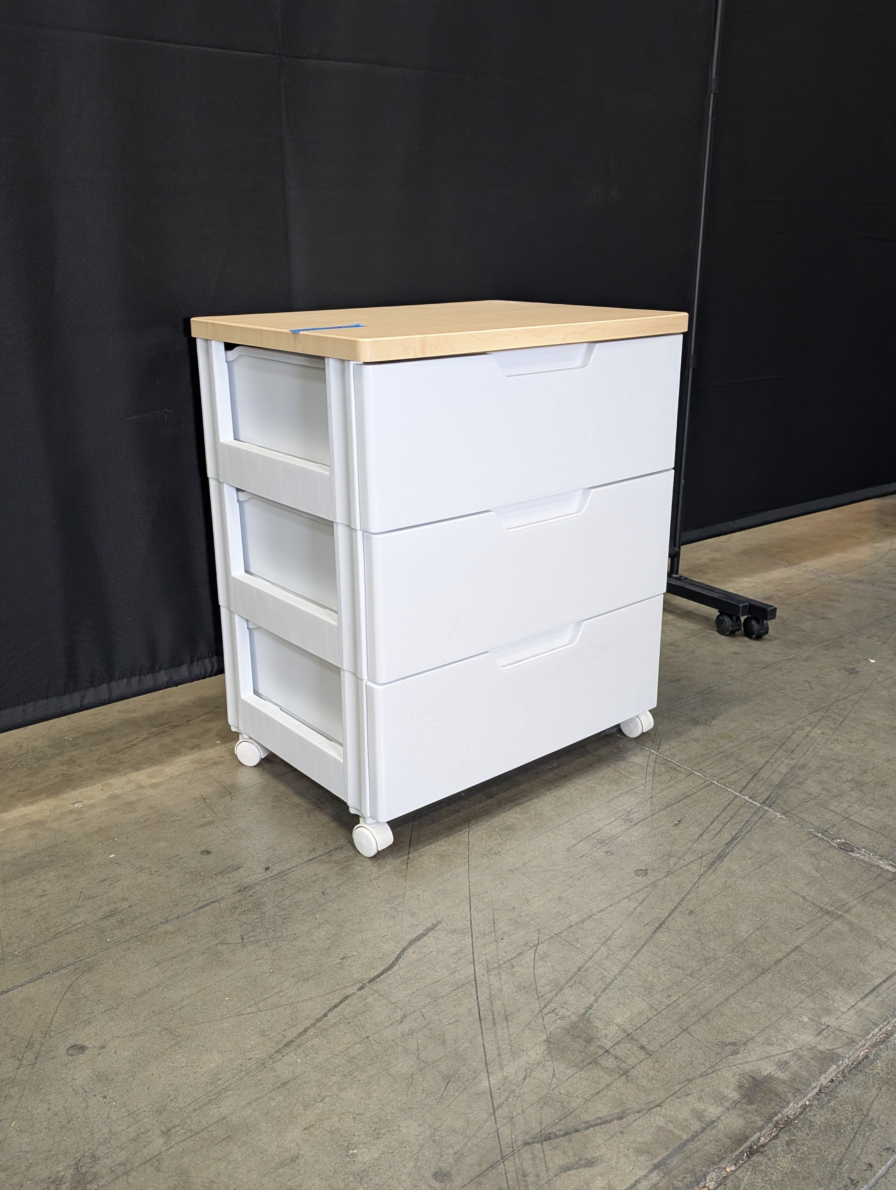 Contemporary White Three-Drawer Chest with Light Wood Surface