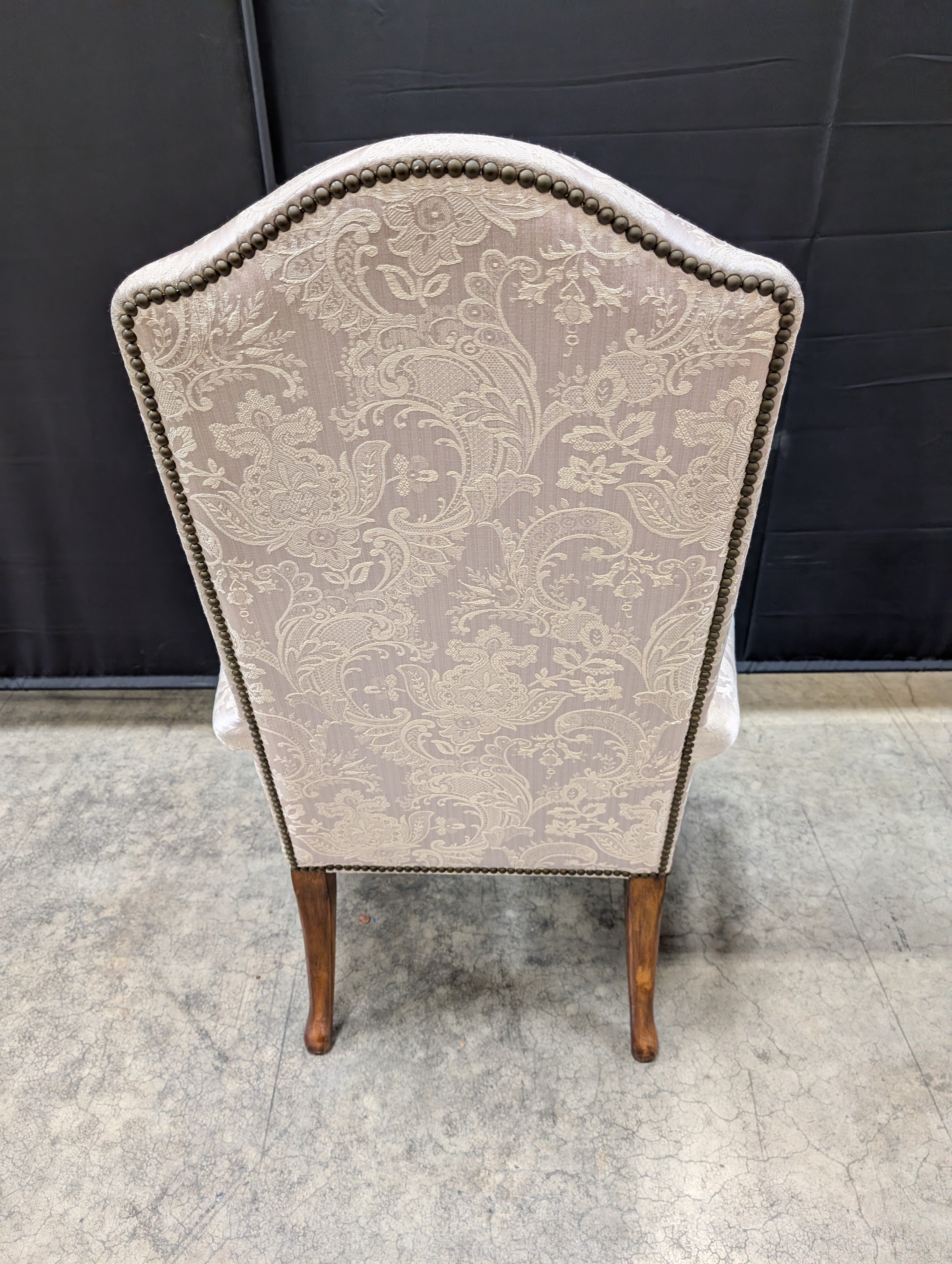 Ornate Carved Wood High-Back Armchair with Damask Upholstery