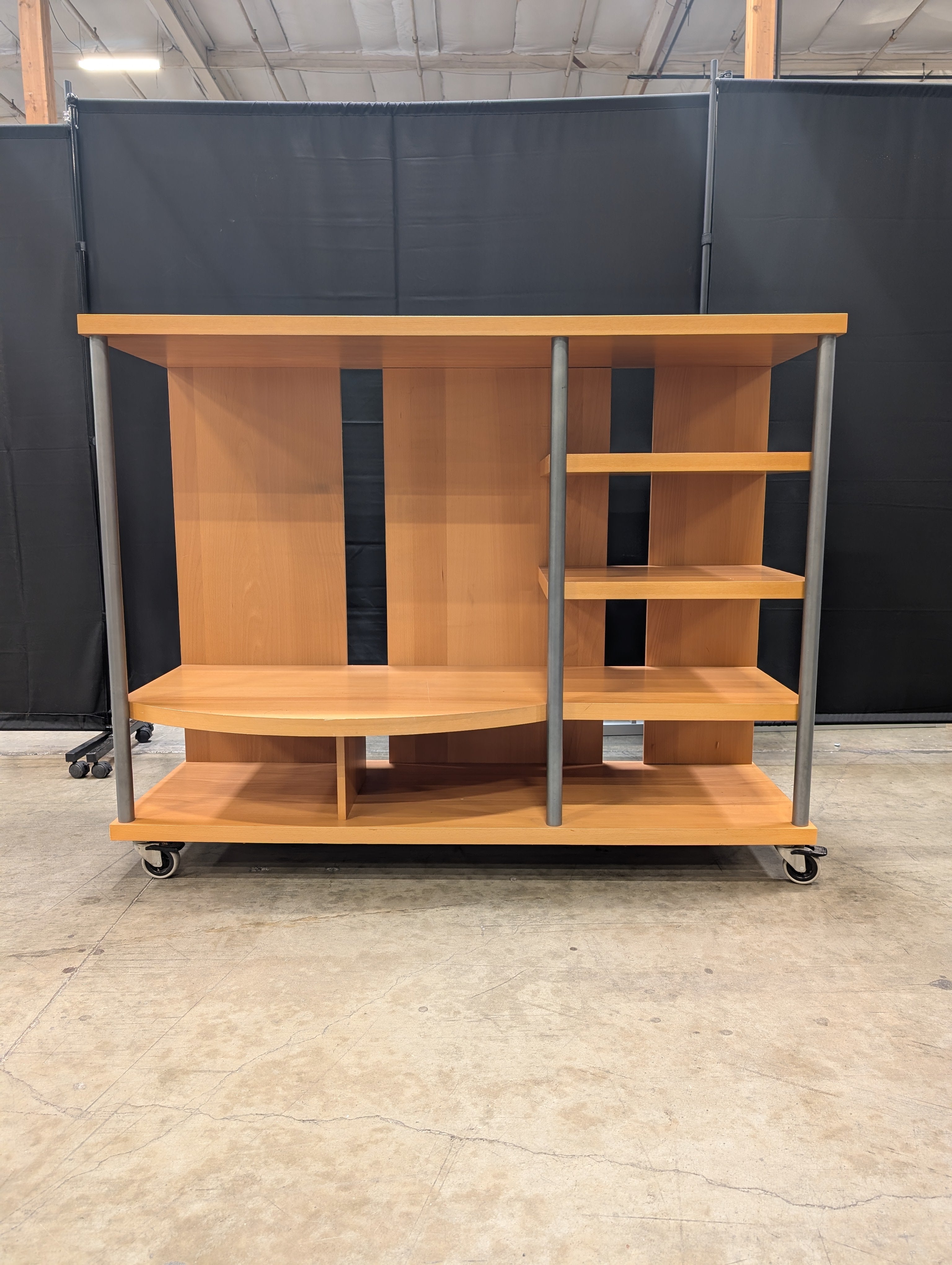 Contemporary Wood Tone Shelving Unit with Metal Supports and Casters