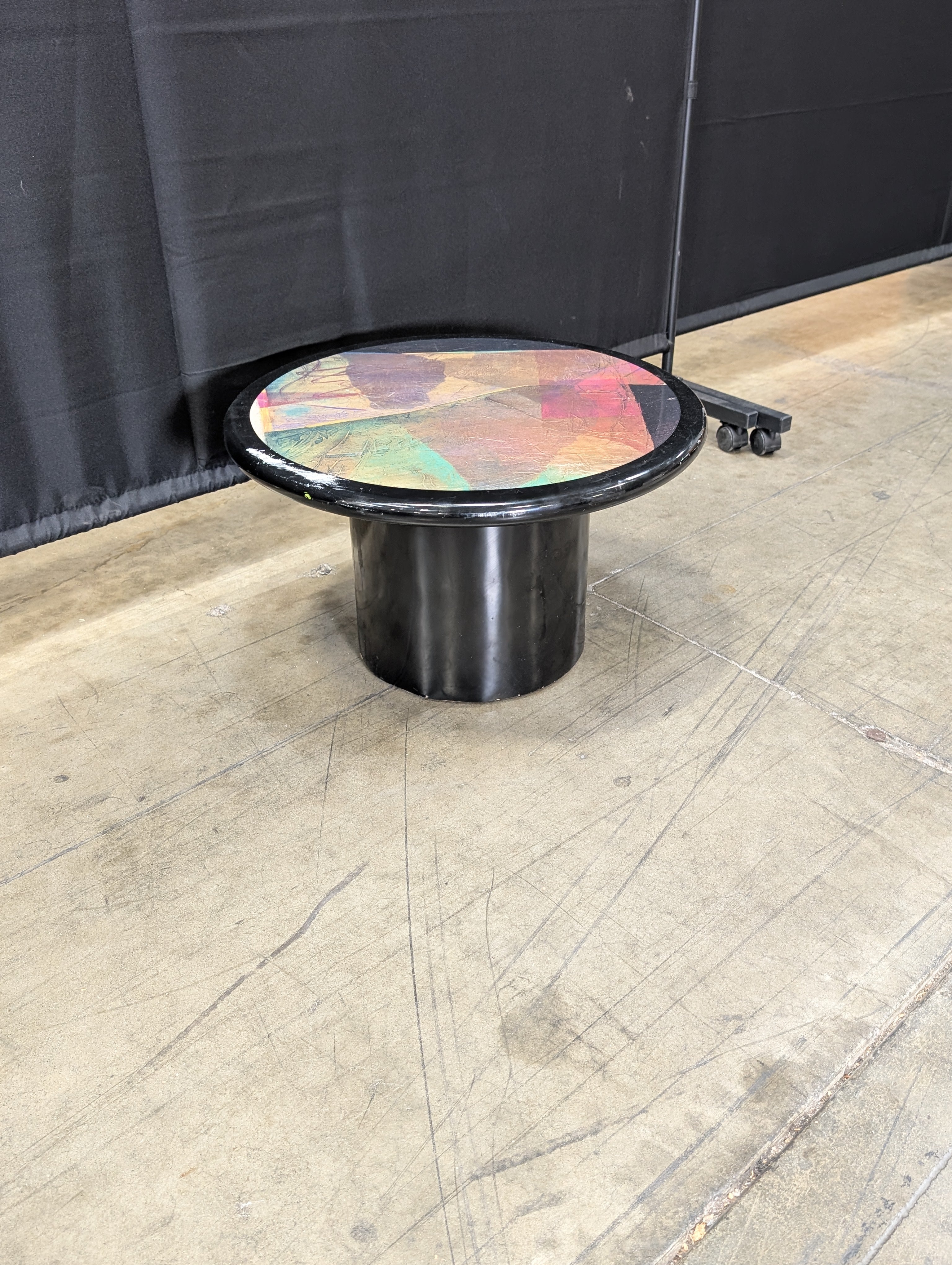 Striking Round Pedestal Coffee Table with Iridescent Top