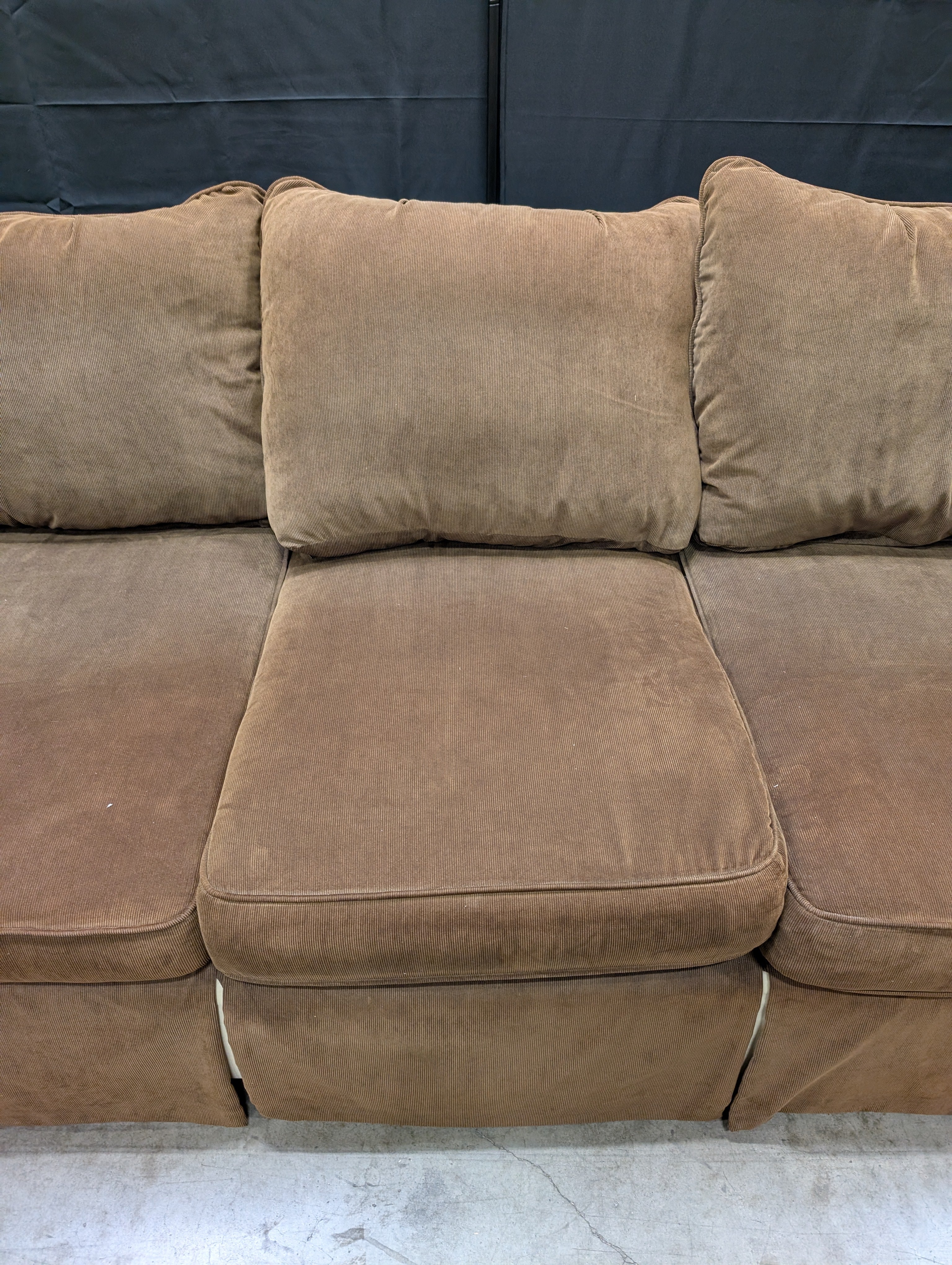 Spacious Brown Fabric Three-Seater Sofa