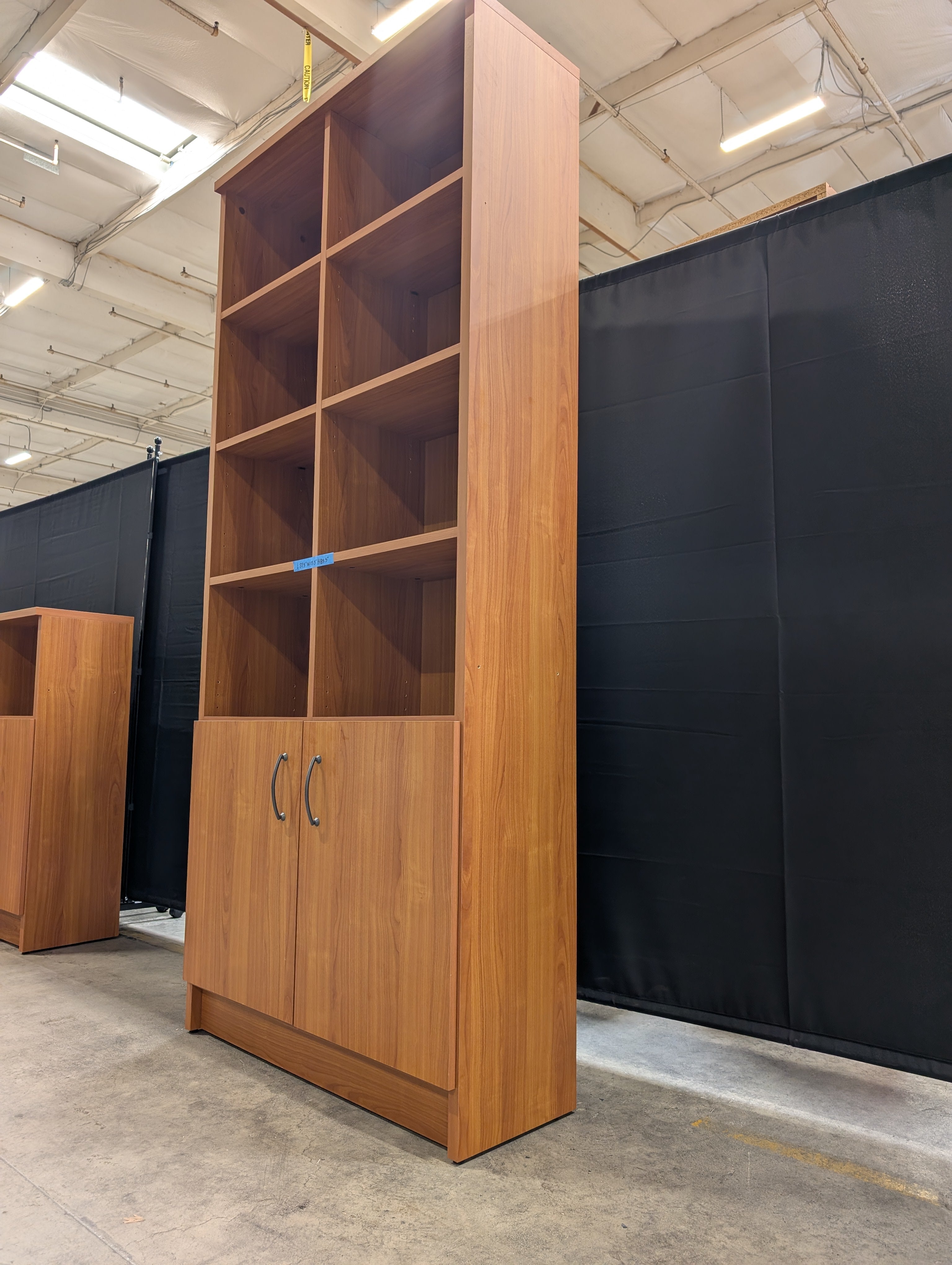 Cherry Wood Tone Multi-Section Bookcase with Lower Cabinet