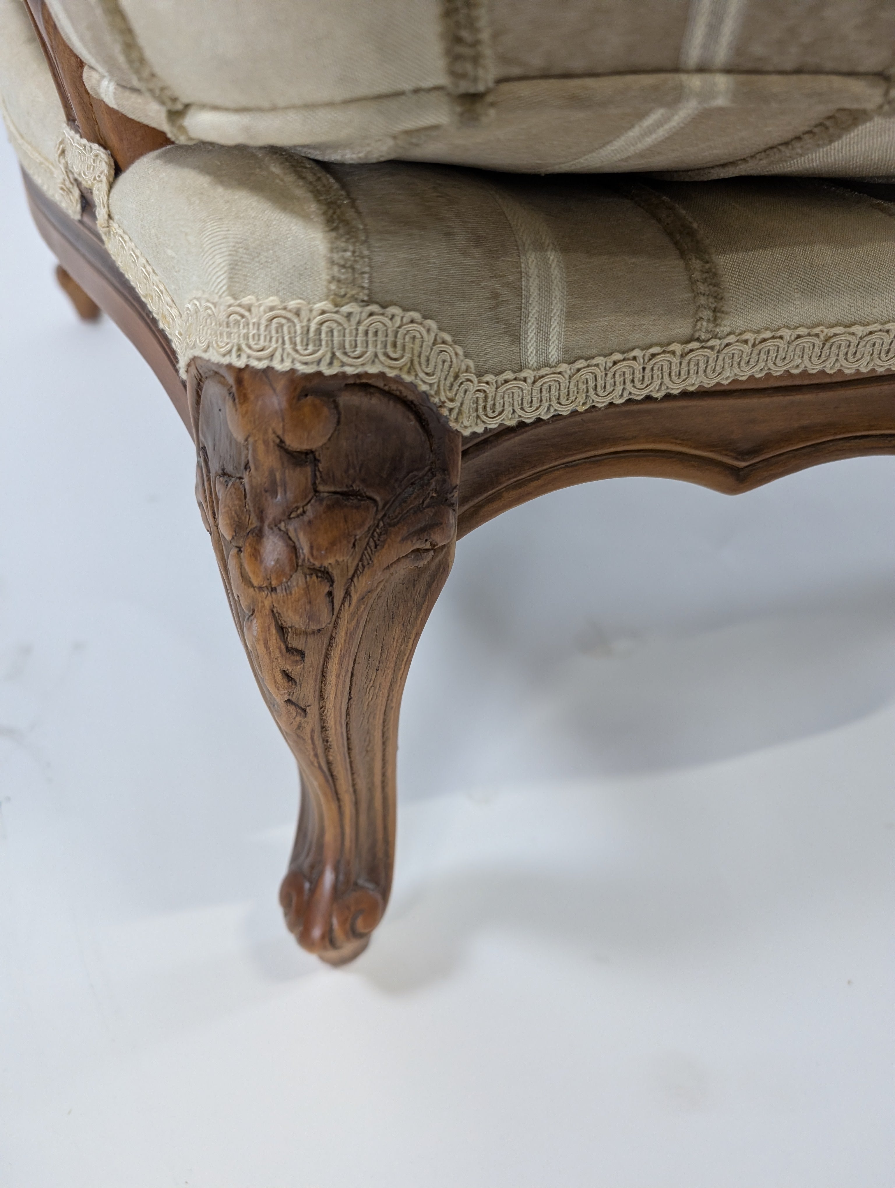 Ornate Carved Wood Armchair with Striped Upholstery