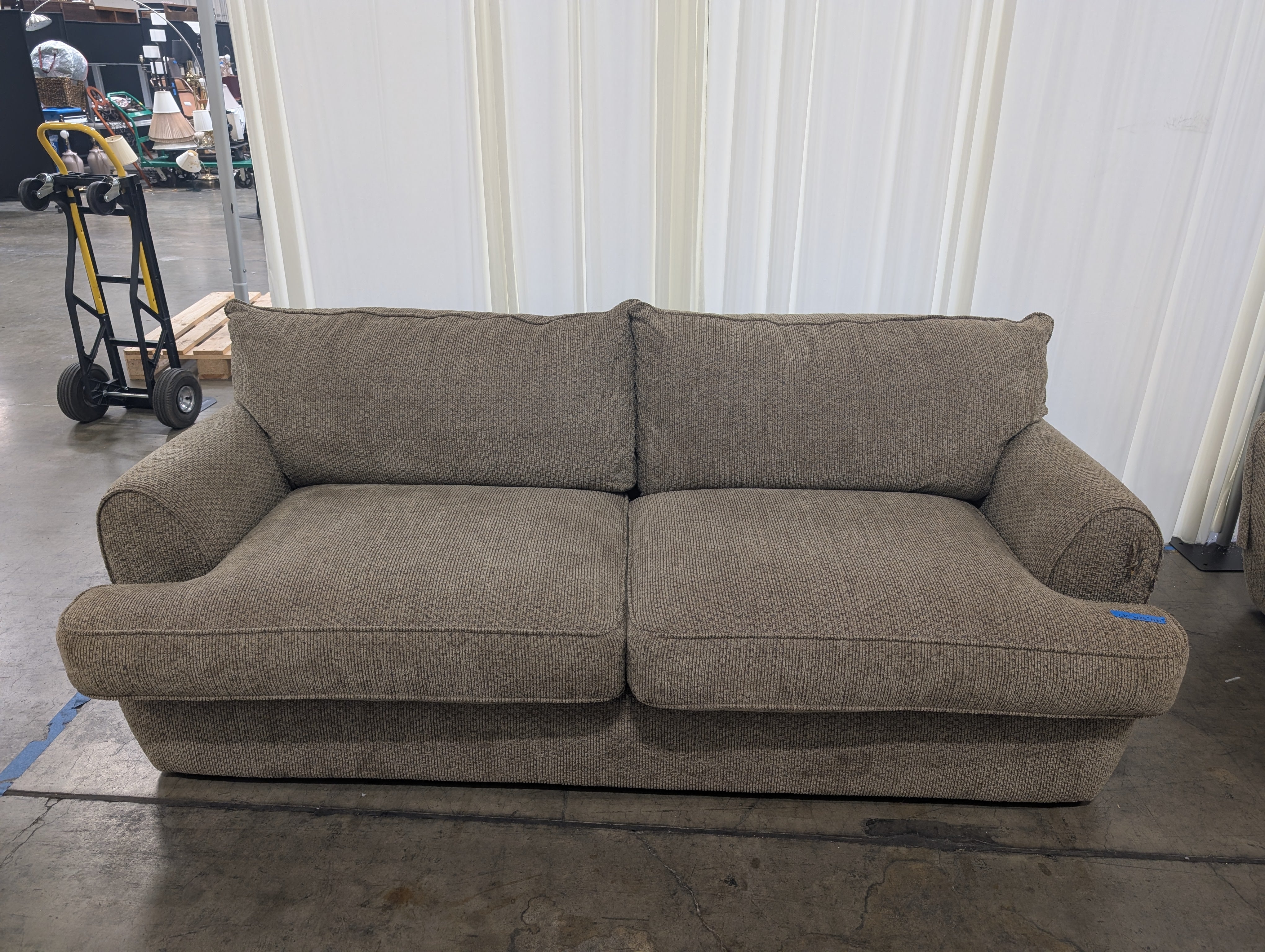 Textured Tan Fabric Two-Cushion Couch with Rolled Arms