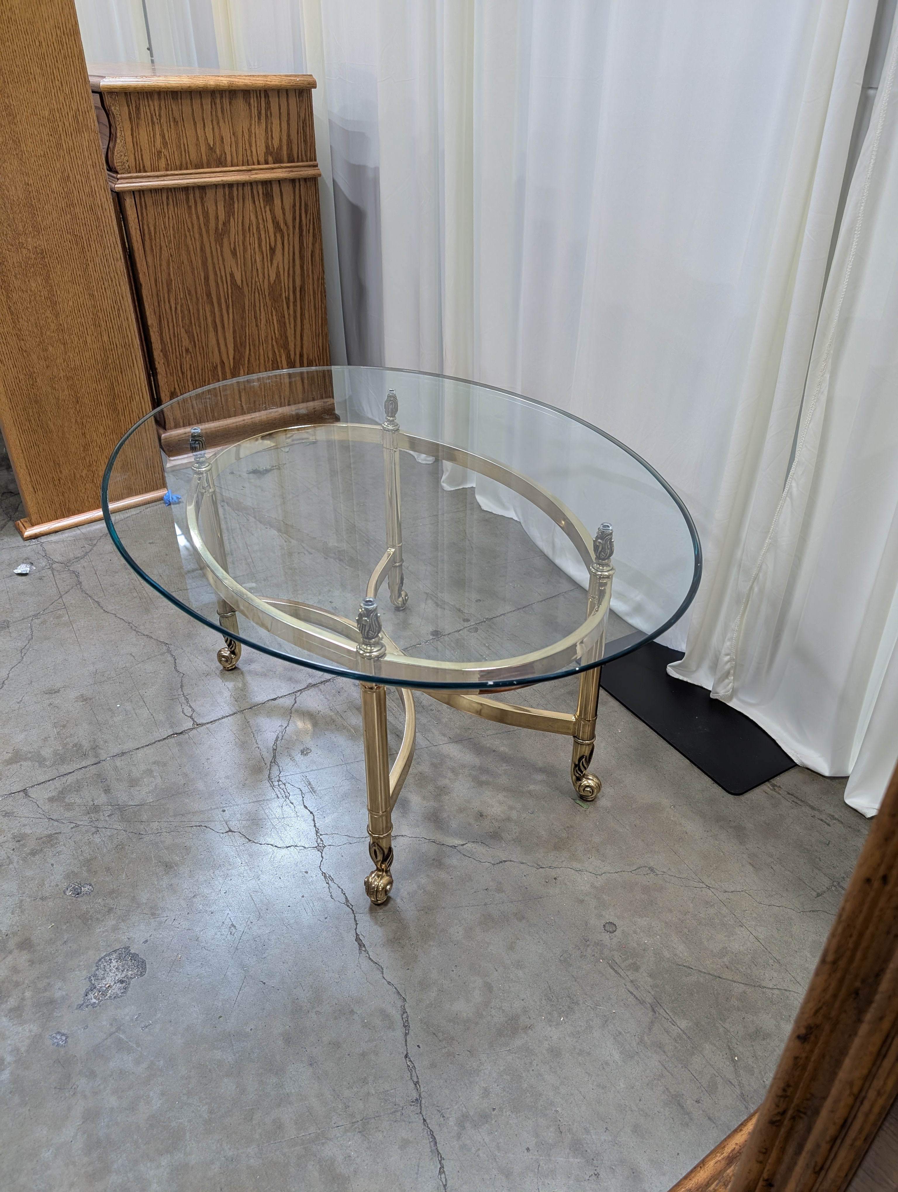 Oval Glass Top Coffee Table with Casters