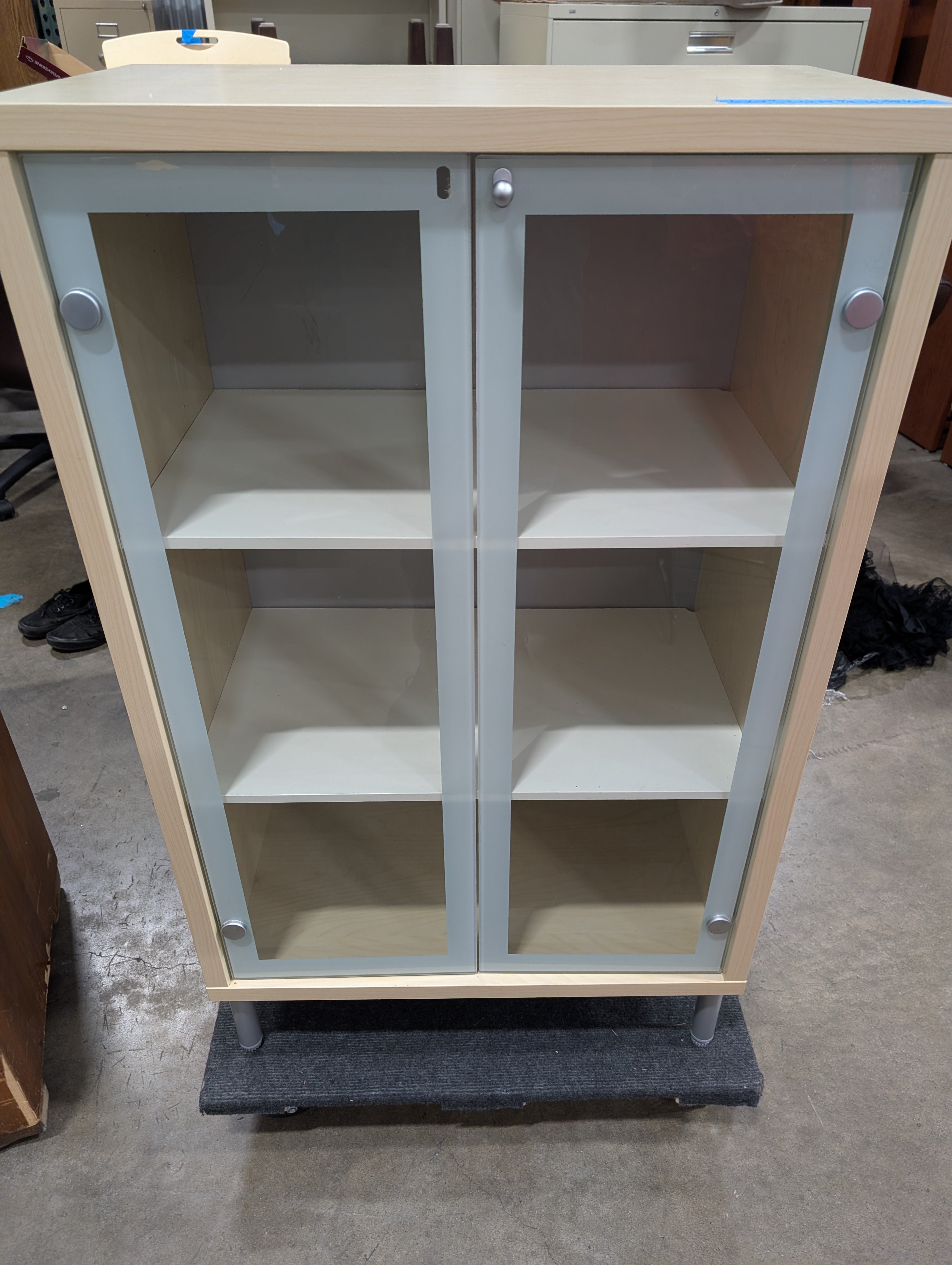 Light Wood Glass-Front Cabinet with Shelving