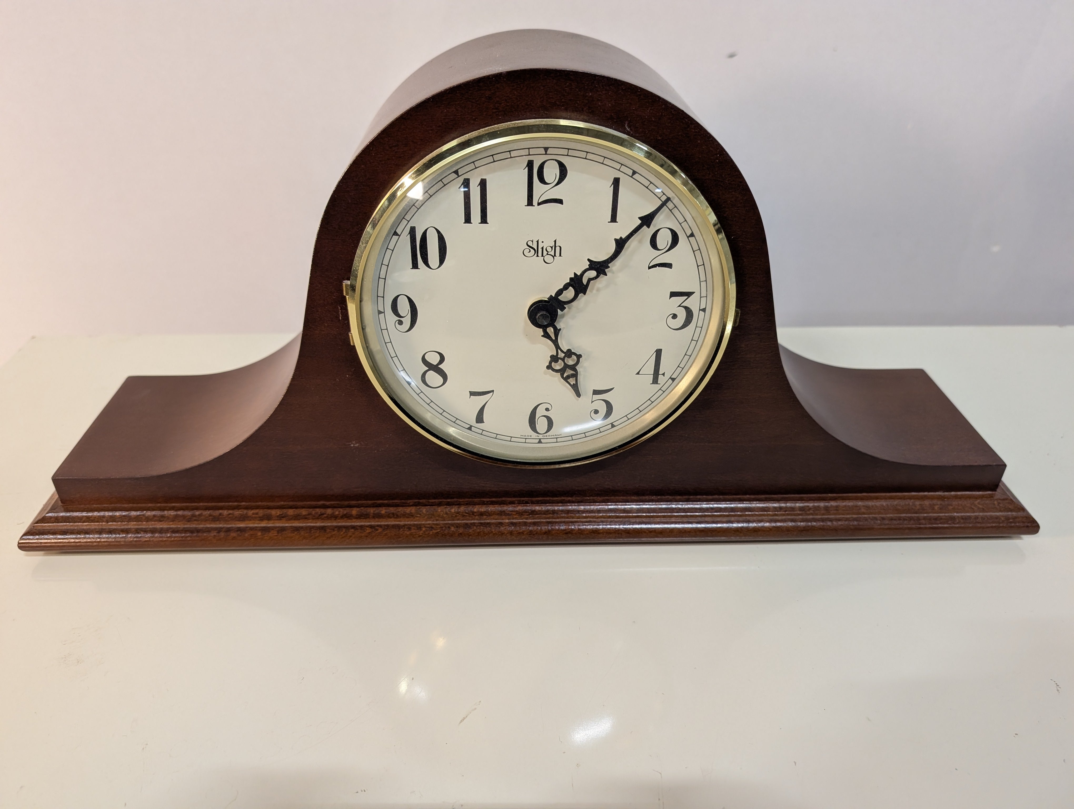 Curved Dark Wood Table Clock with Brass Tone Bezel