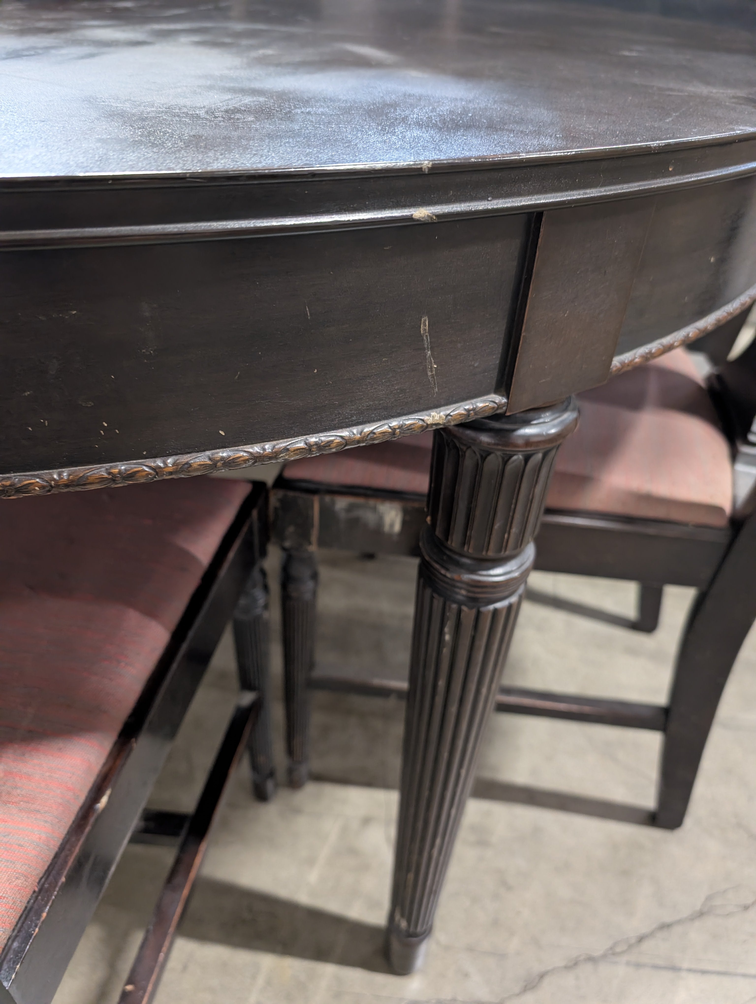 Dark Wood Oval Extendable Dining Table with Seven matching Chairs