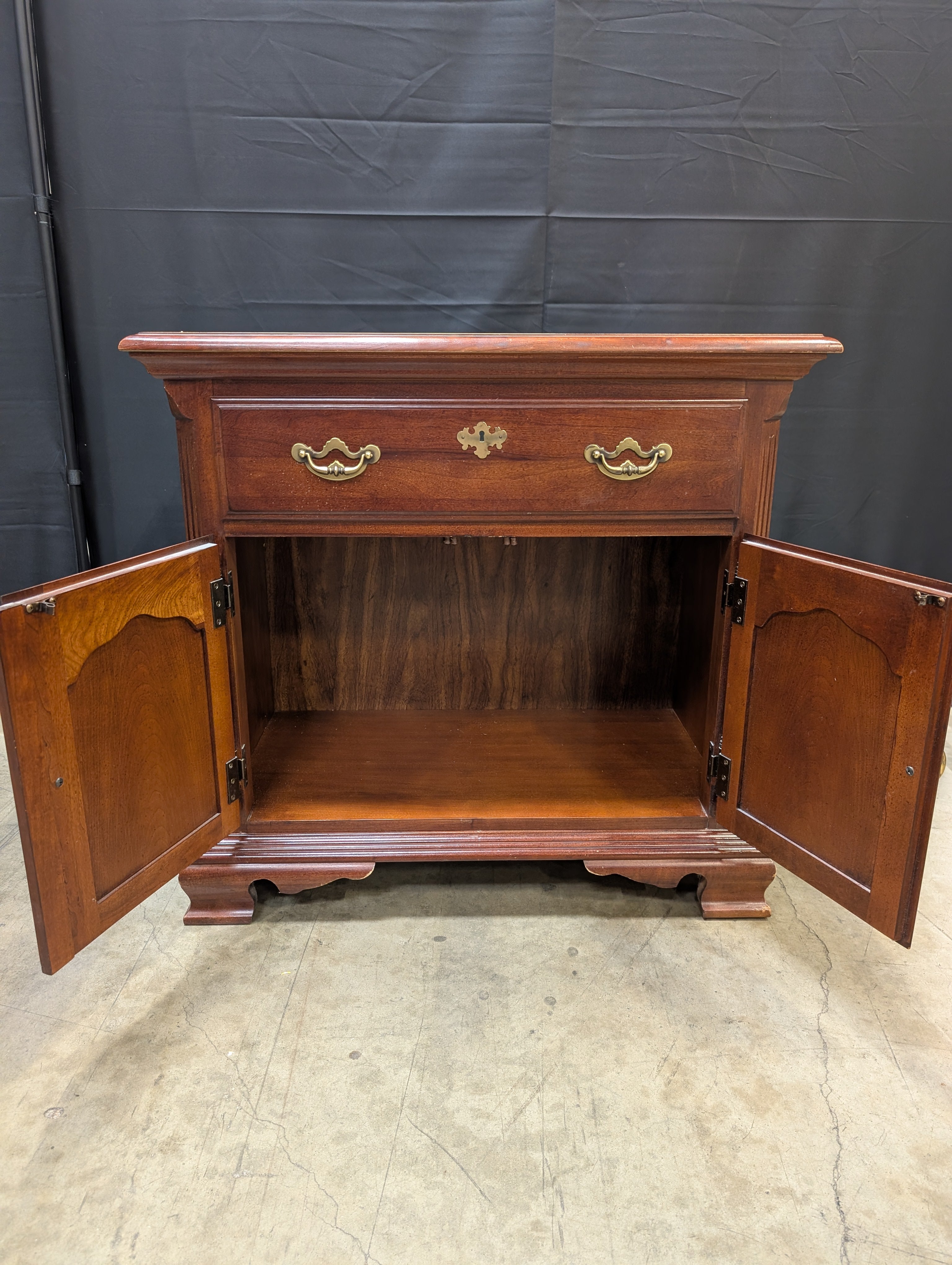 Traditional Reddish Brown Wood Accent Cabinet with Ornate Hardware