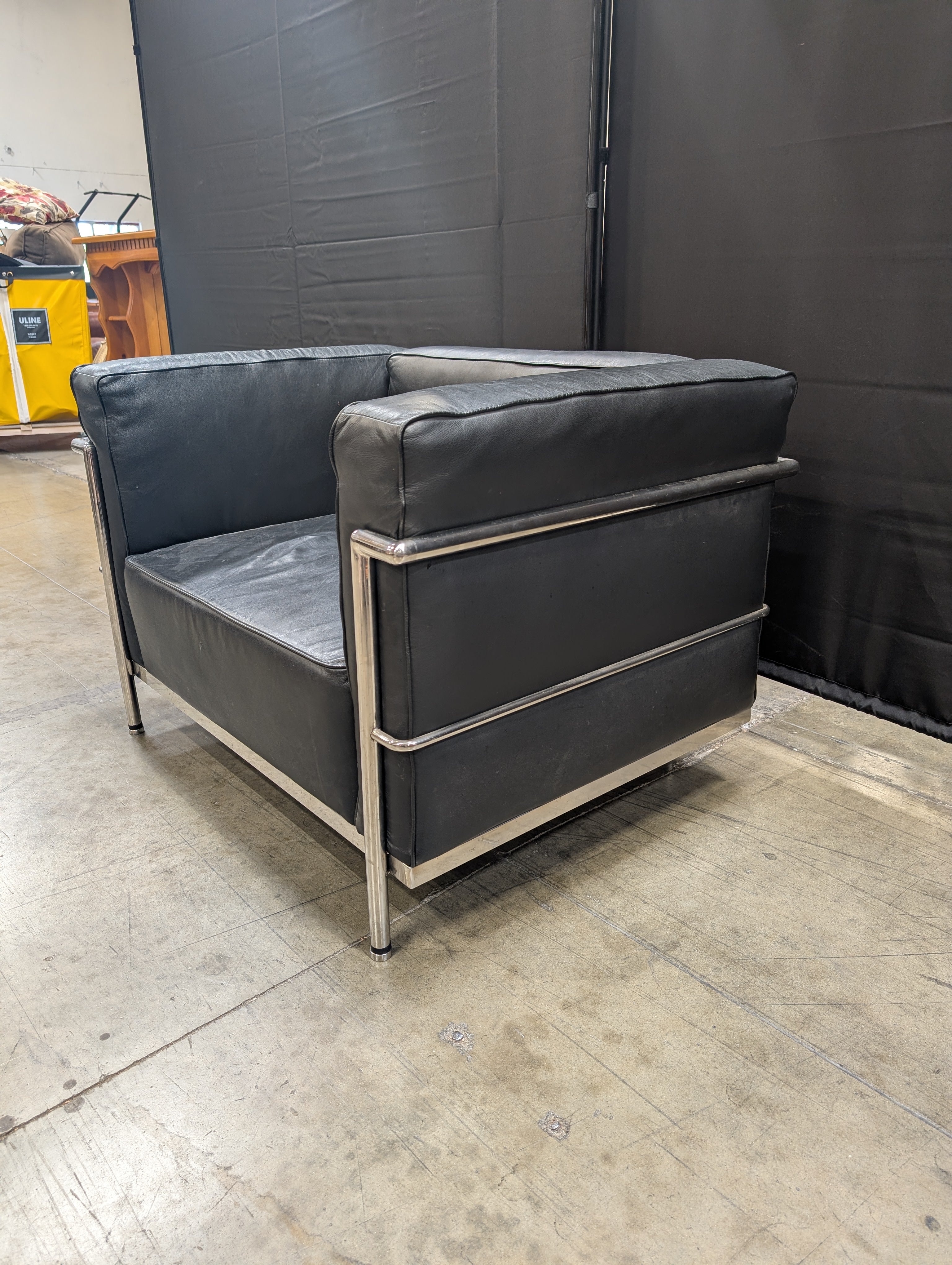 Modern Black Armchair with Polished Metal Frame