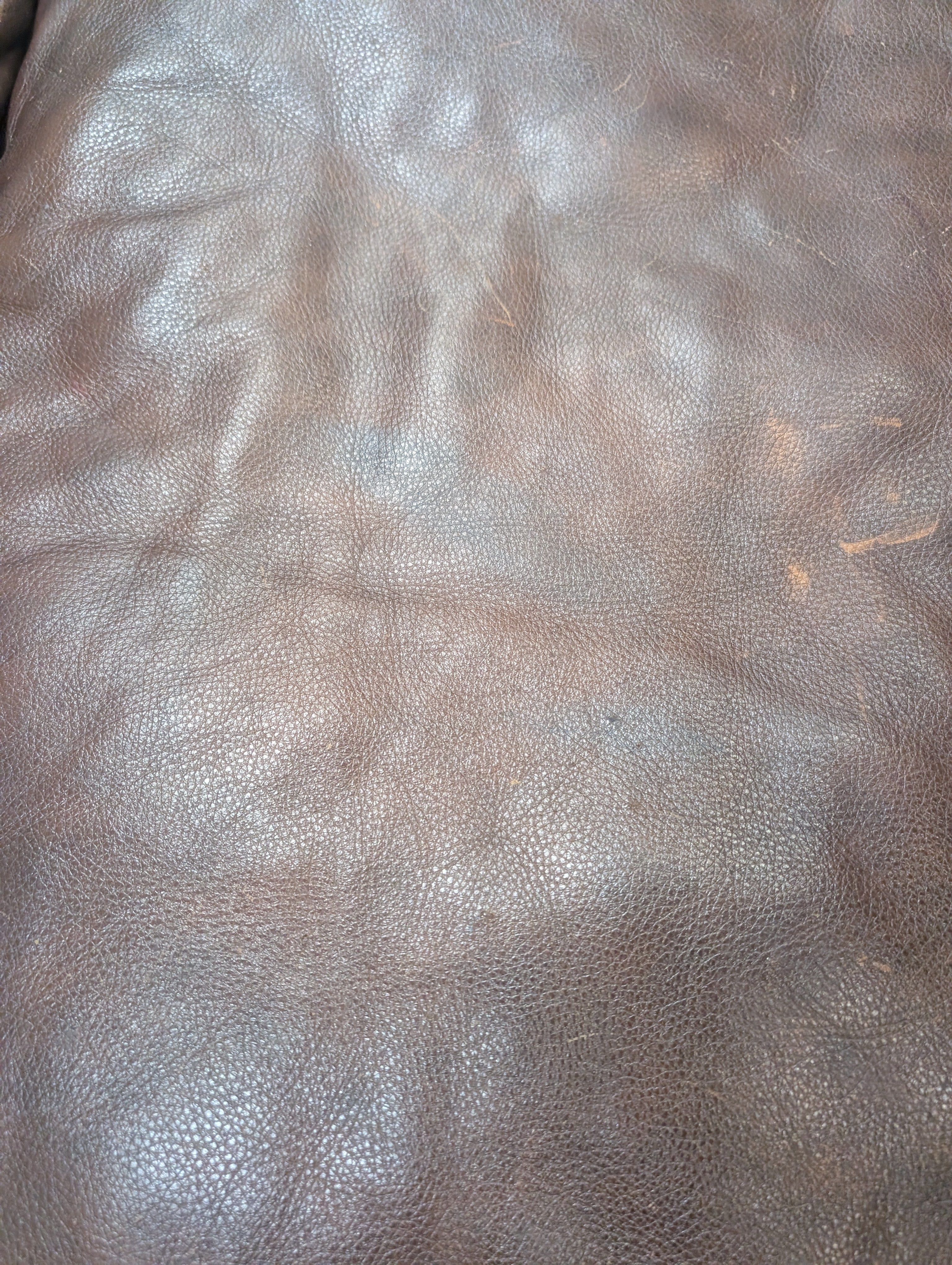 Dark Brown Leather Rolled Arm Couch with matching Ottoman