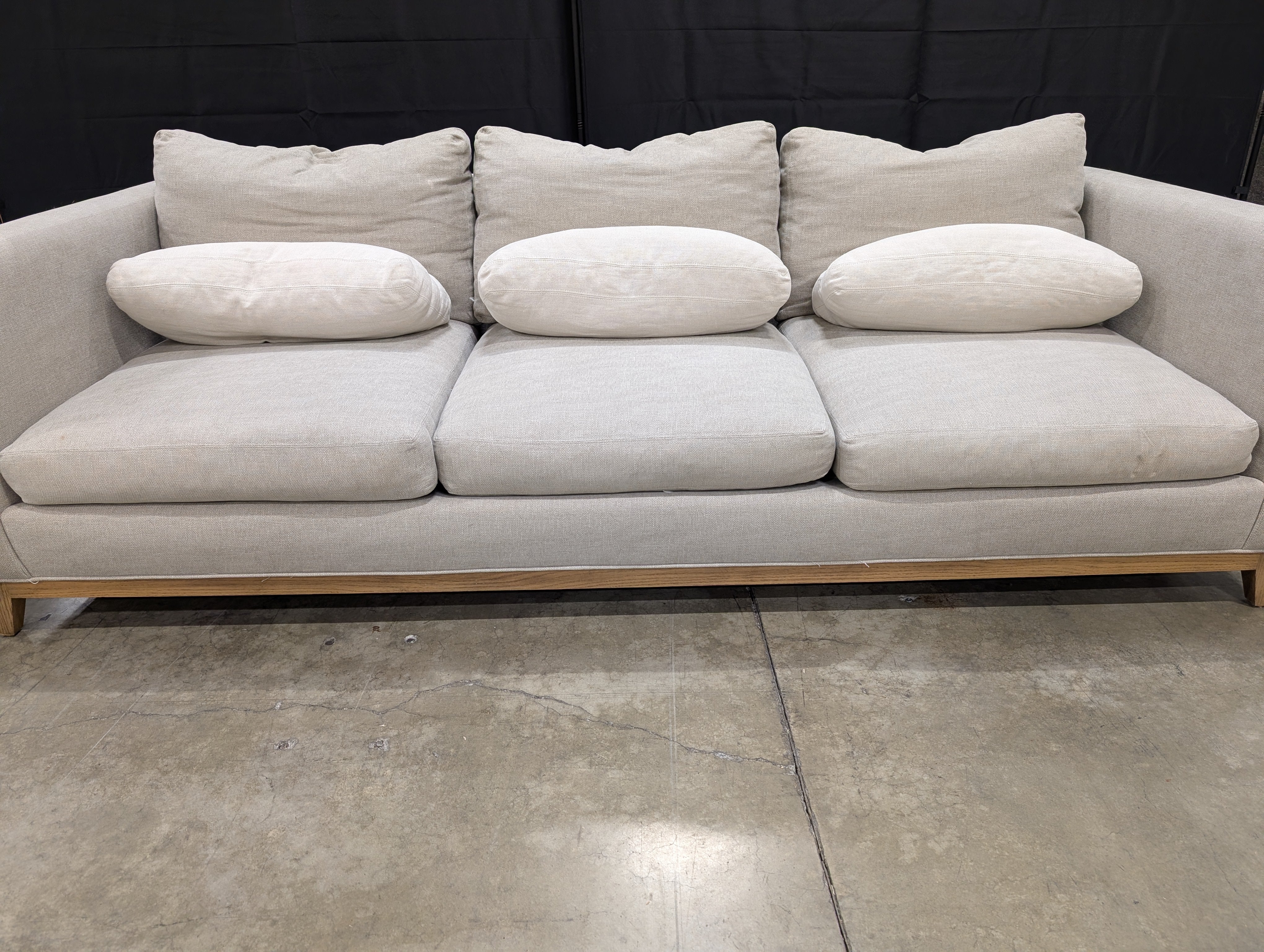 Crate & Barrel Oatmeal Fabric Sofa with Wood Base and Bolster Pillows