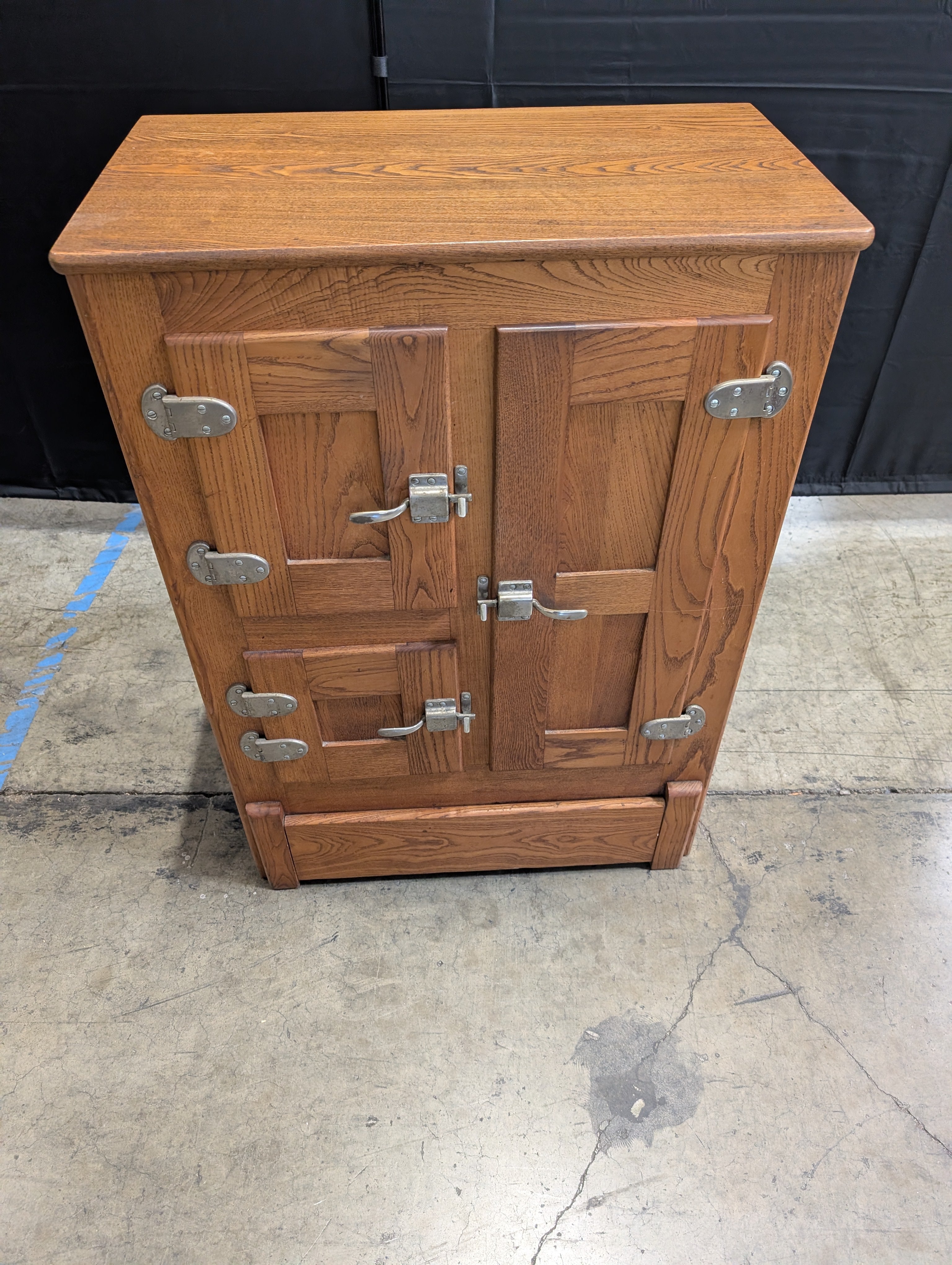 Rustic Wood Storage Cabinet with Paneled Doors and Metal Latches