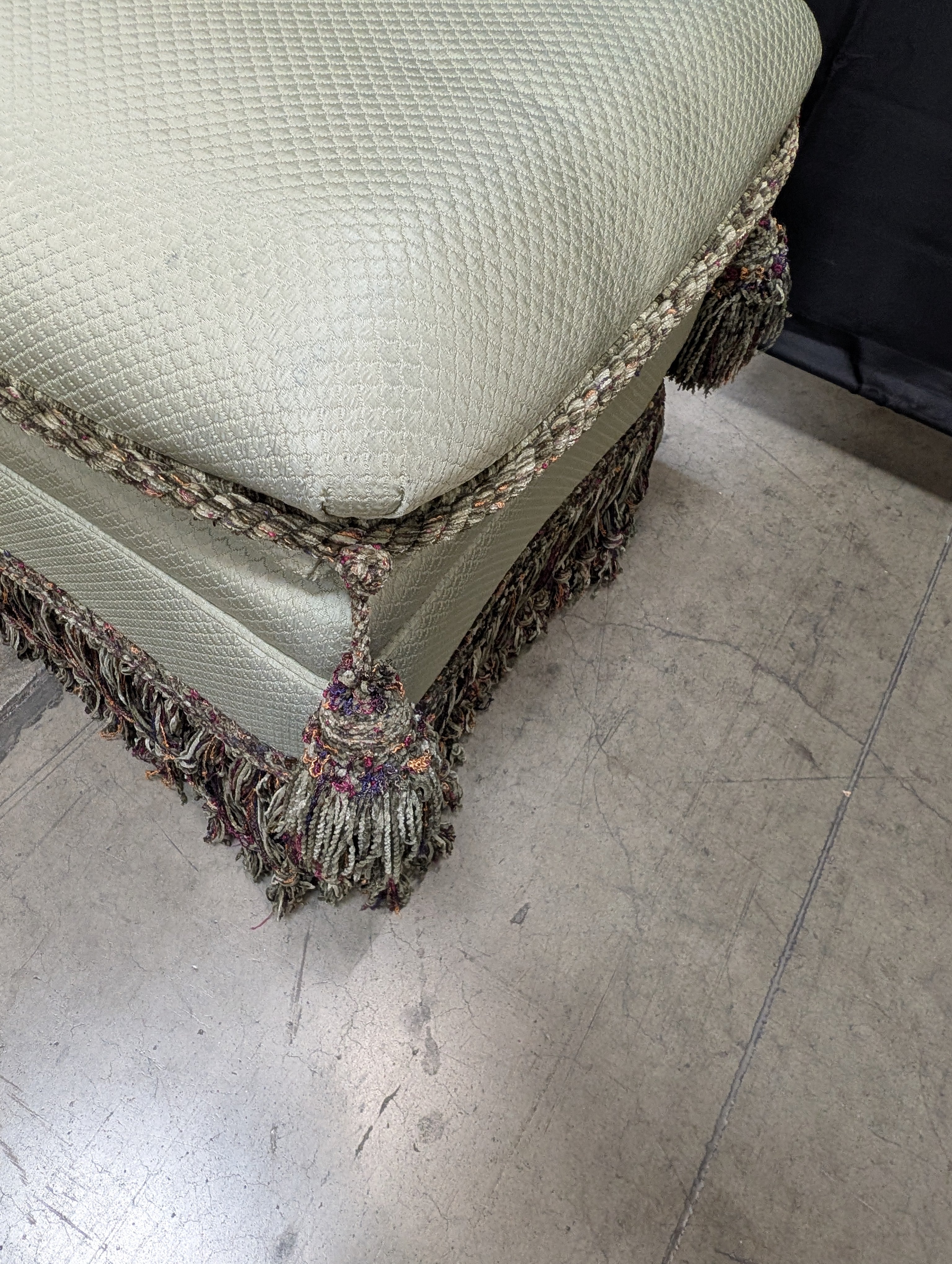 Textured Upholstered Cushion with Tassel Fringe Trim