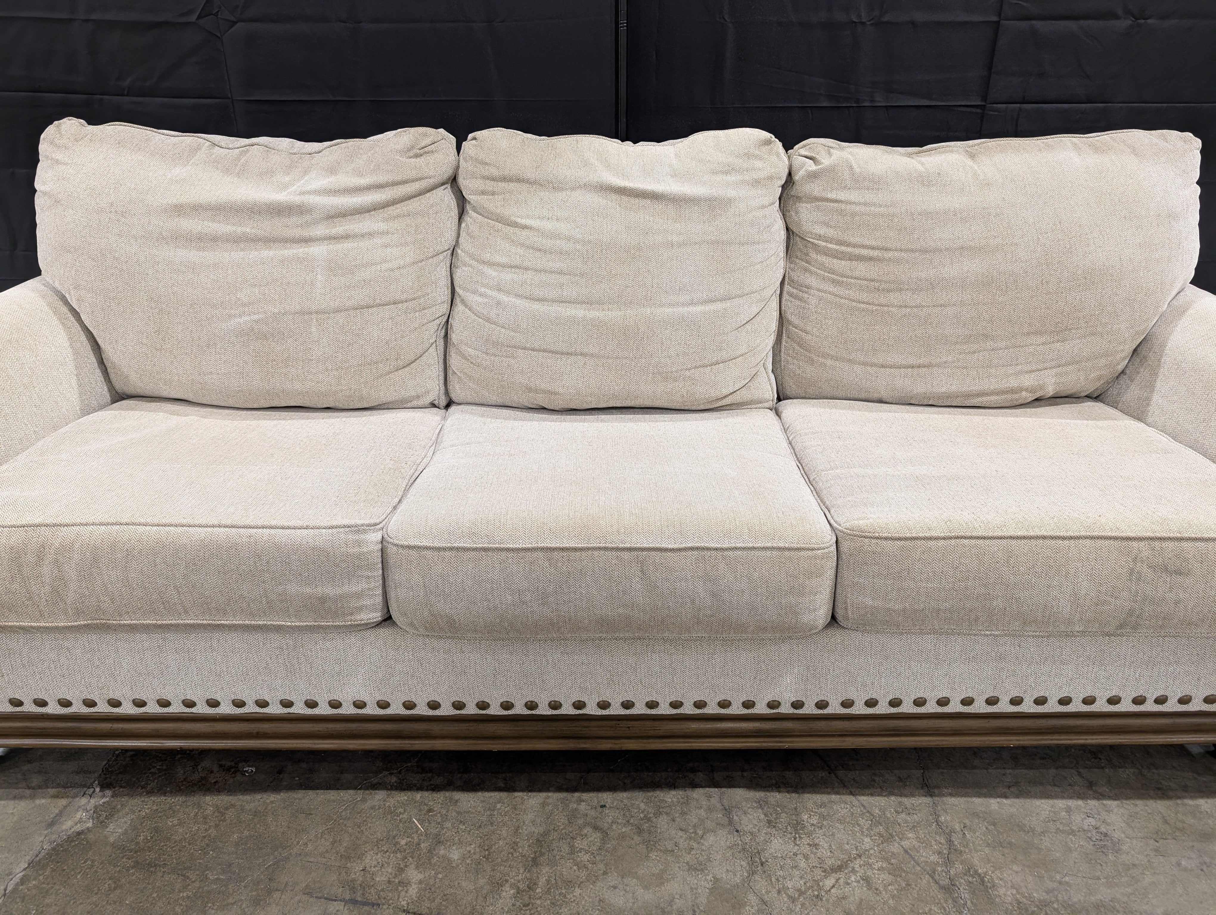Neutral Three-Cushion Nail Trim Sofa