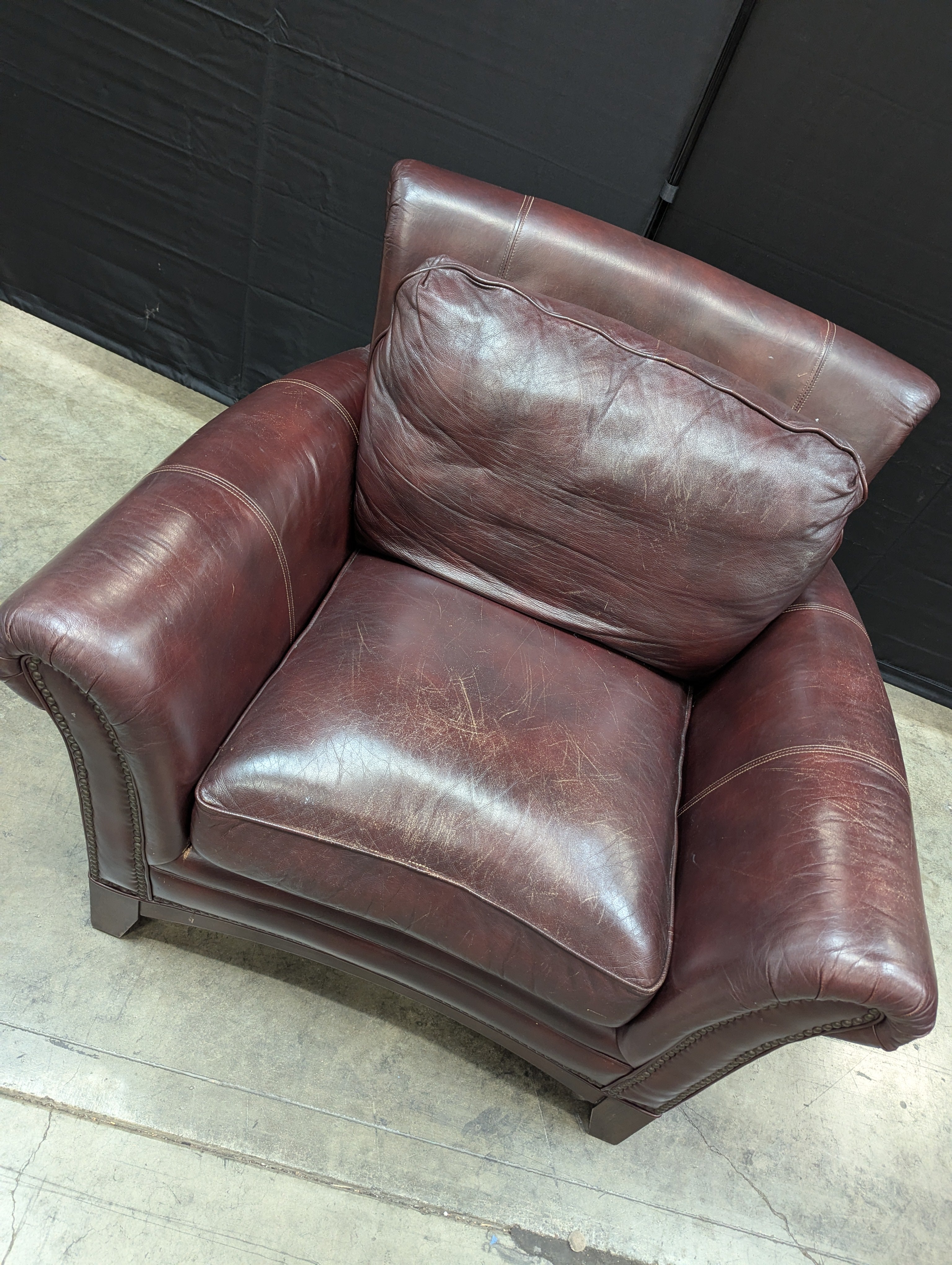Traditional Deep Reddish-Brown Leather Armchair with Nailhead Trim