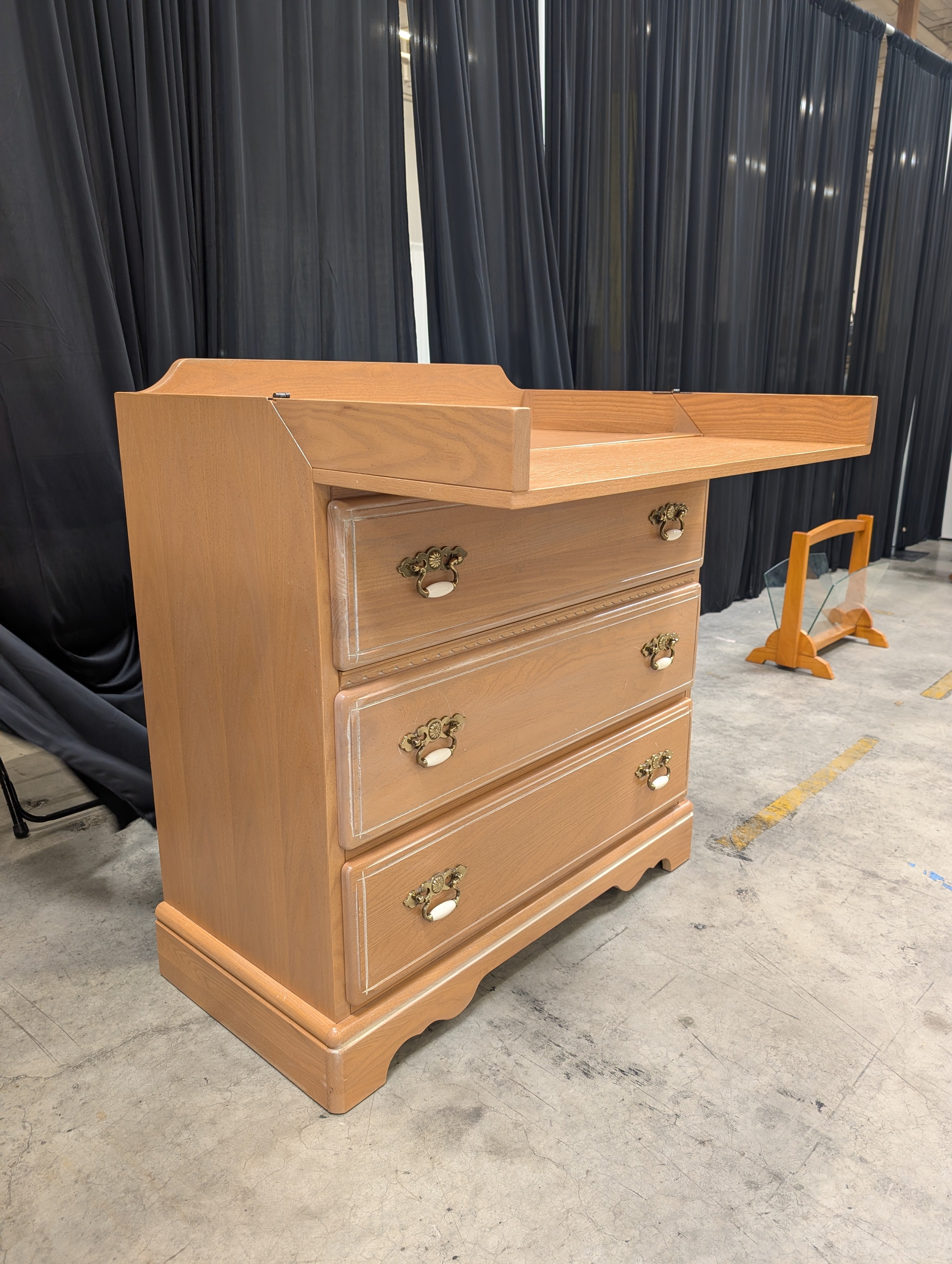 Light Brown Wood Dresser with Ornate Hardware