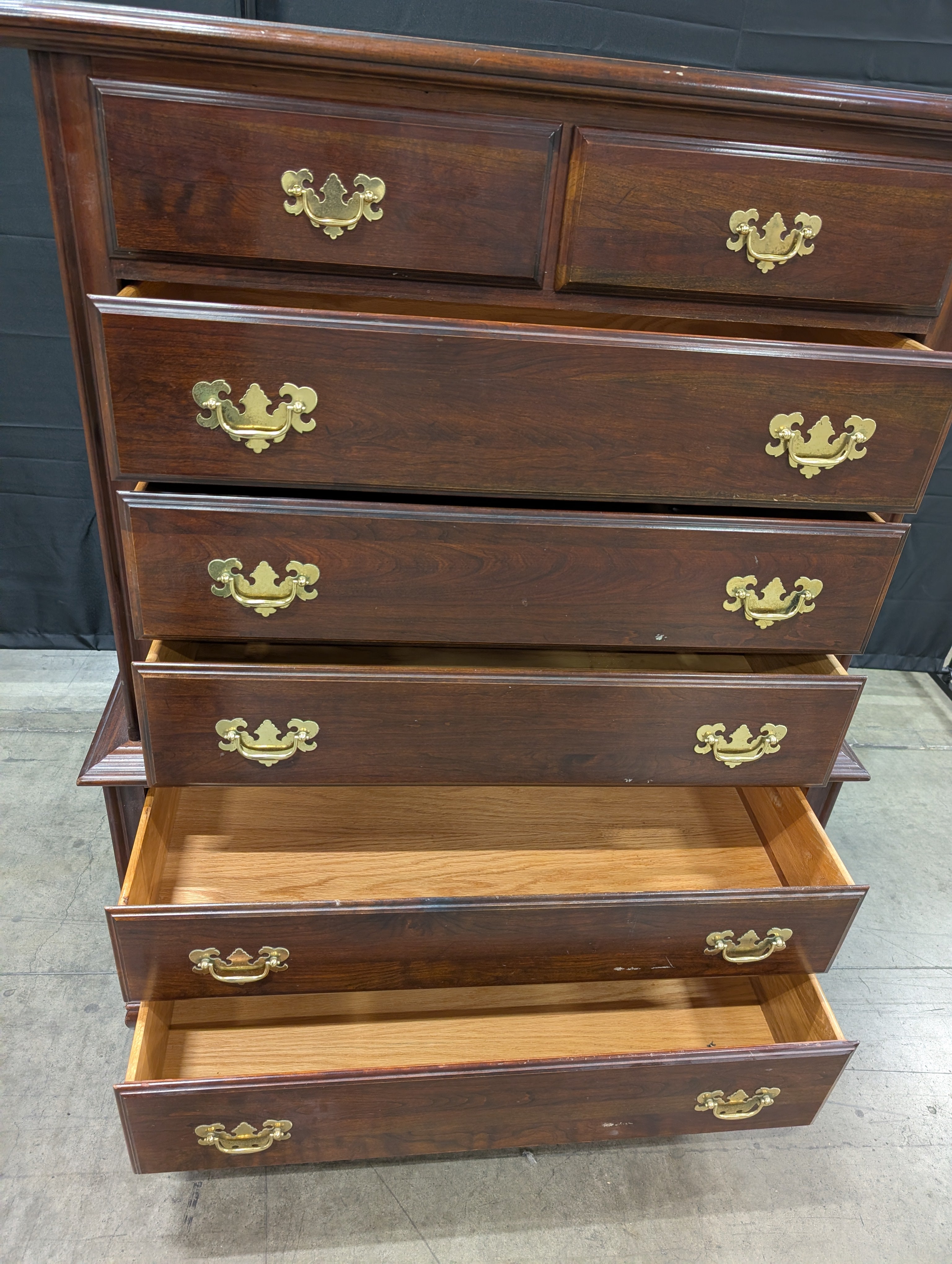Traditional Dark Wood Chest of Drawers with Ornate Brass Pulls