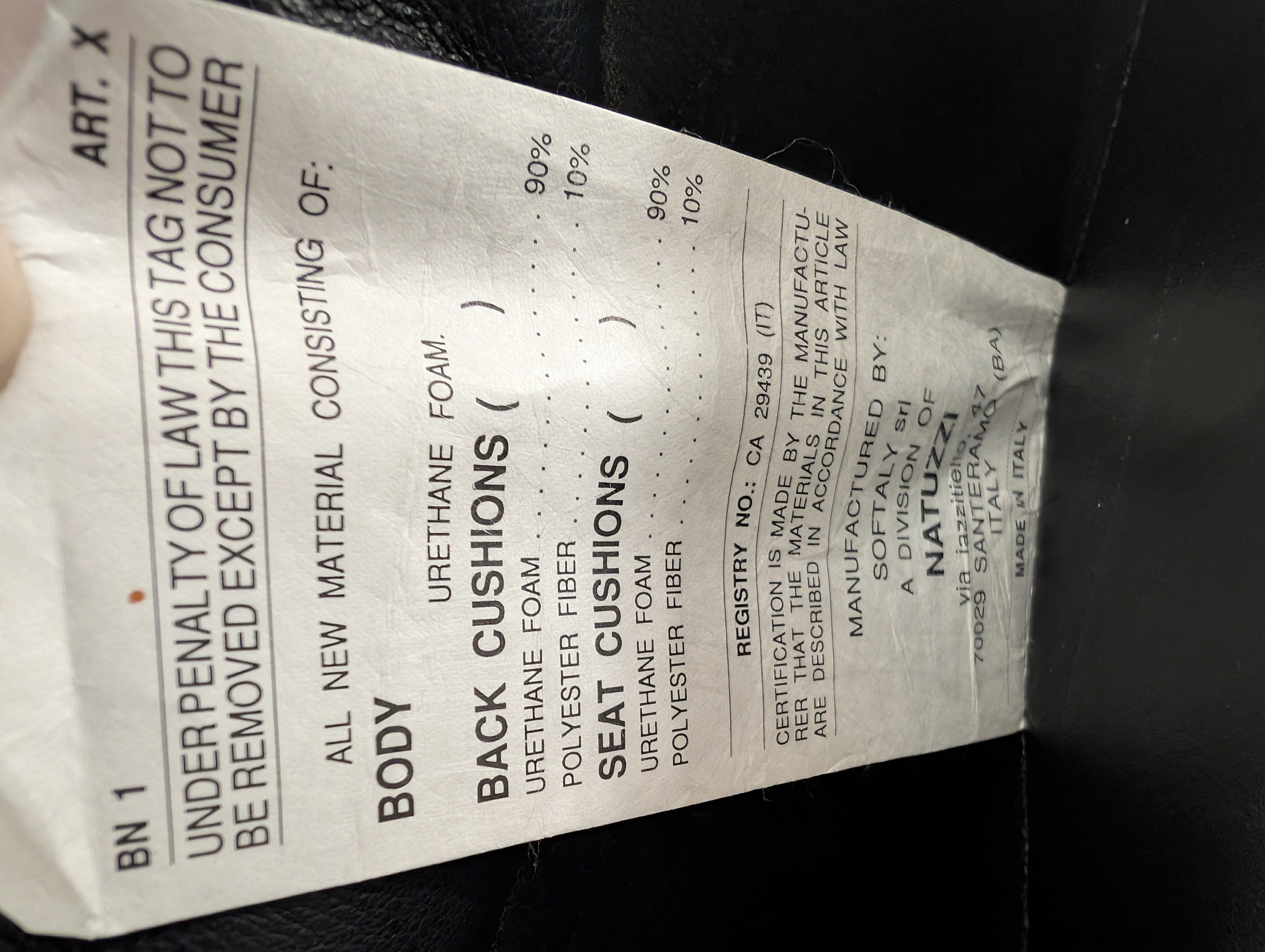 Natuzzi Spacious Black Leather Three-Seater Sofa with Ottoman