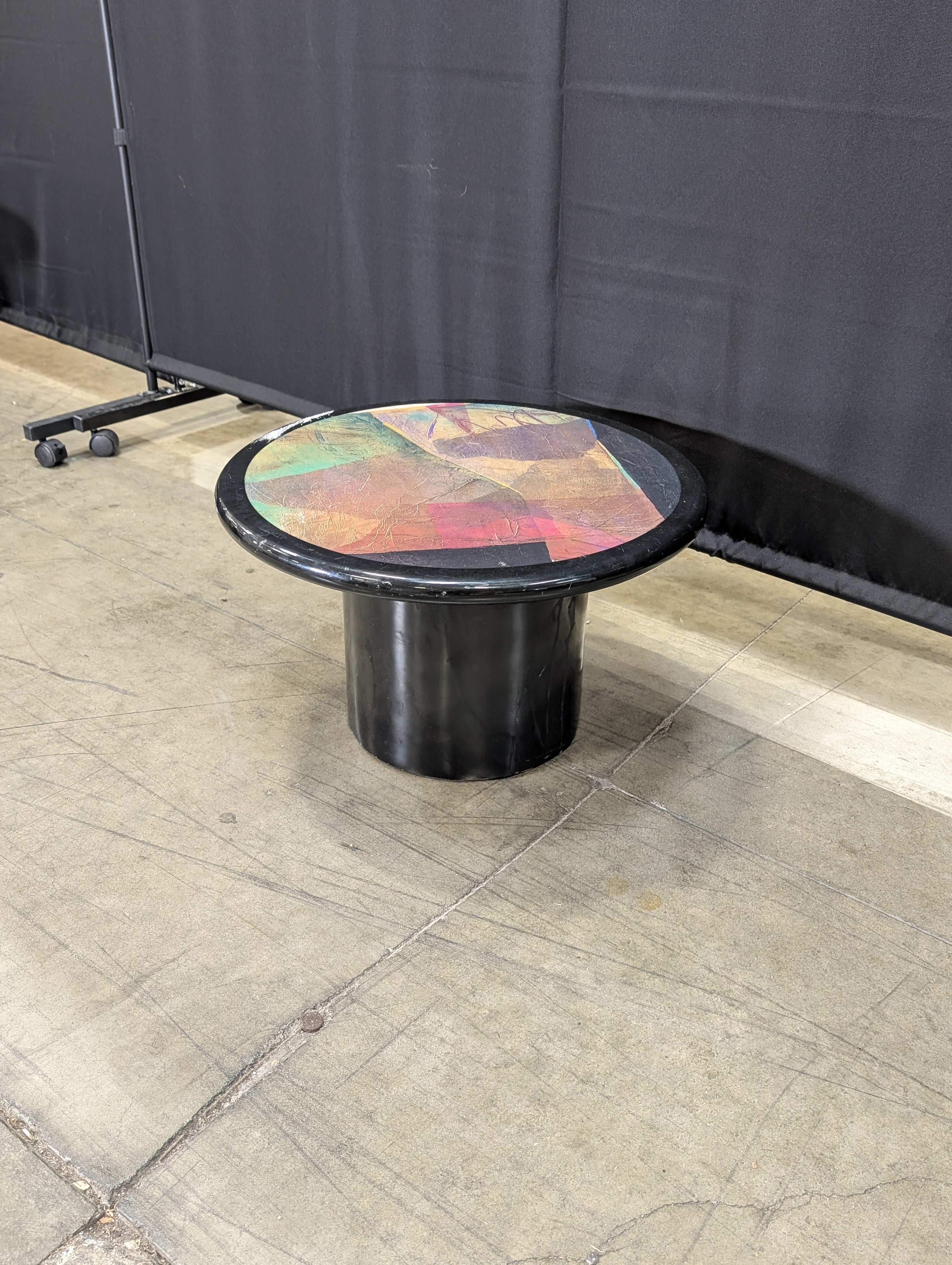 Striking Round Pedestal Coffee Table with Iridescent Top
