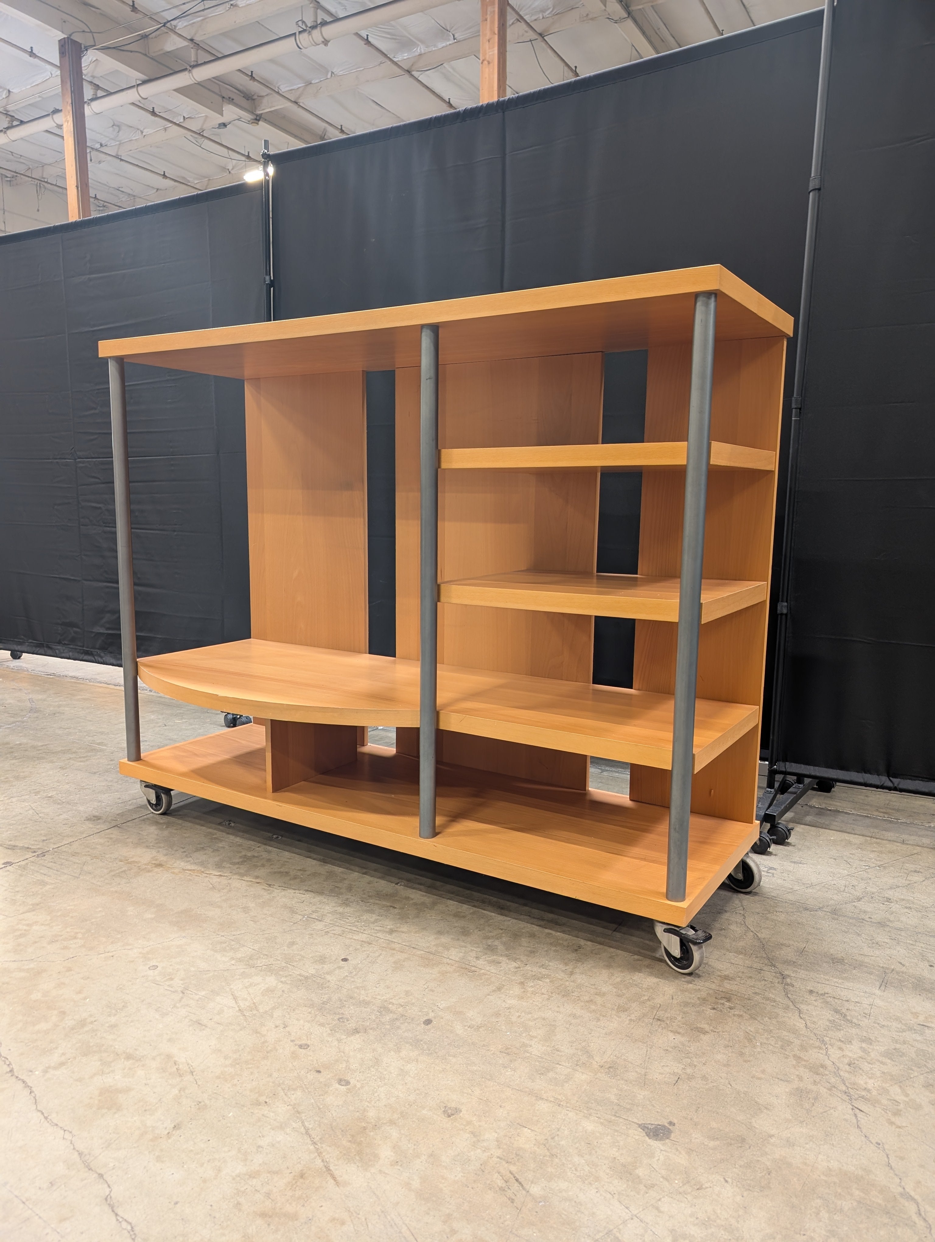 Contemporary Wood Tone Shelving Unit with Metal Supports and Casters