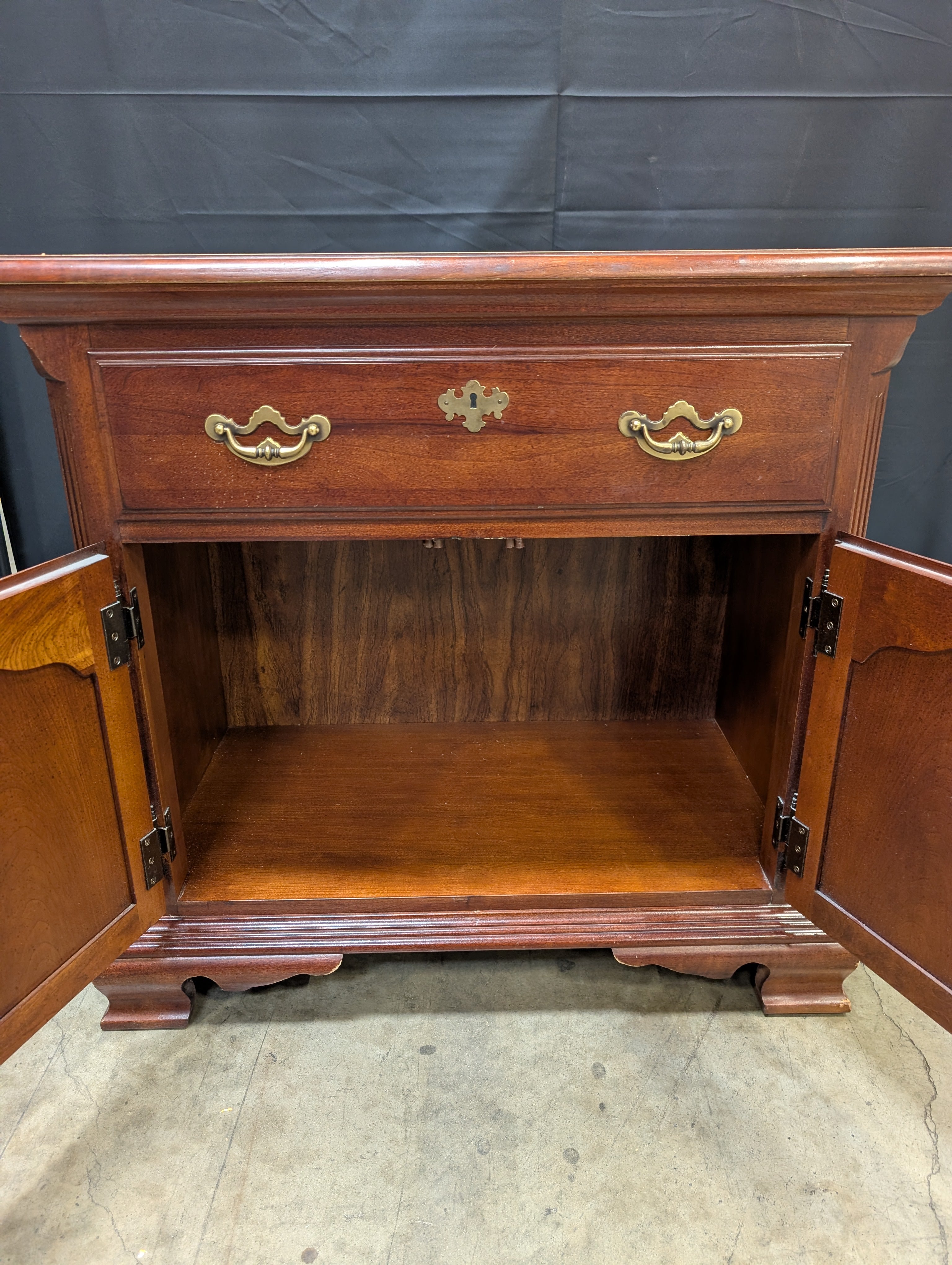 Traditional Reddish Brown Wood Accent Cabinet with Ornate Hardware