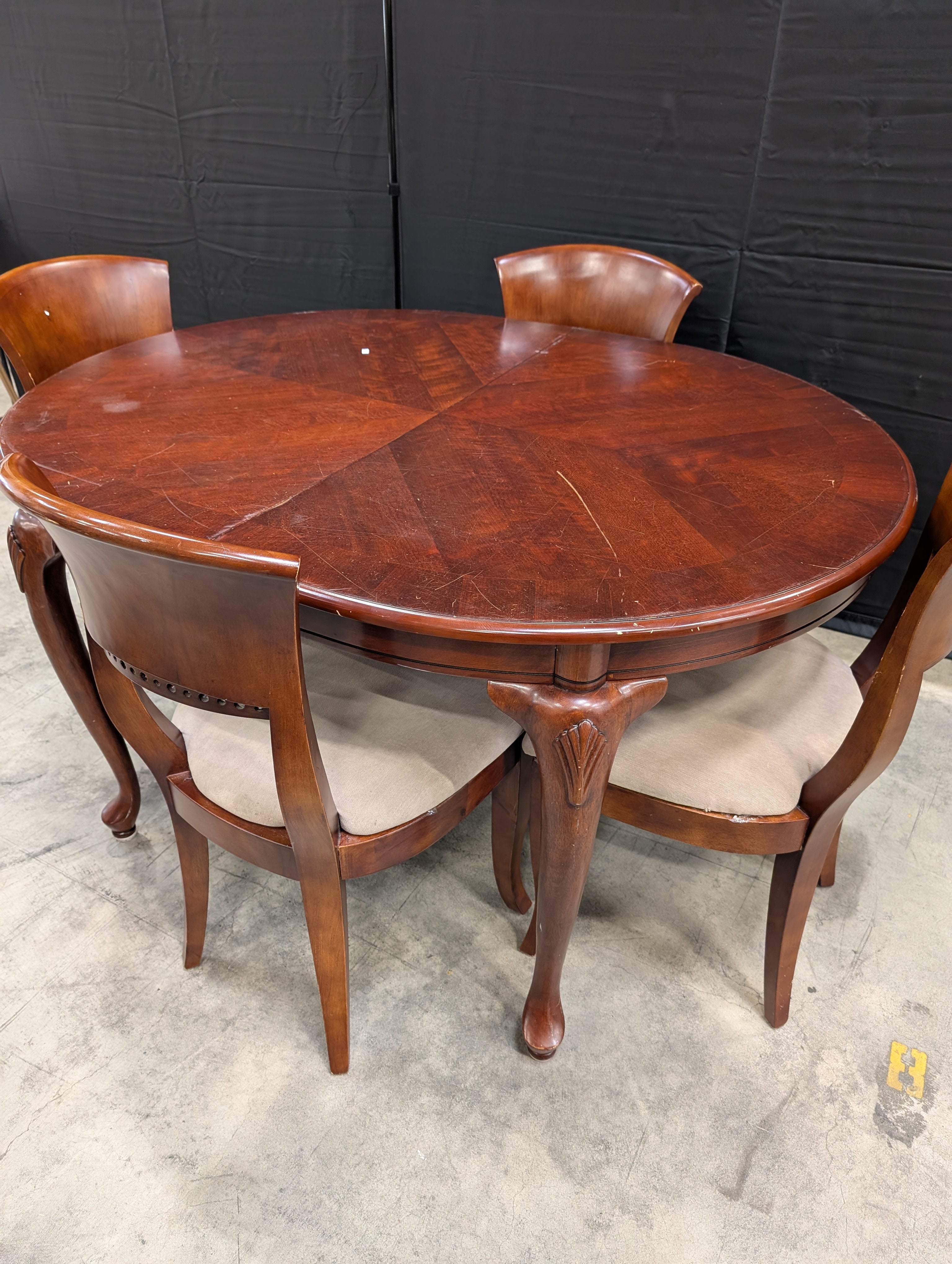 Traditional Dark Wood Oval Dining Table with Four Upholstered Chairs