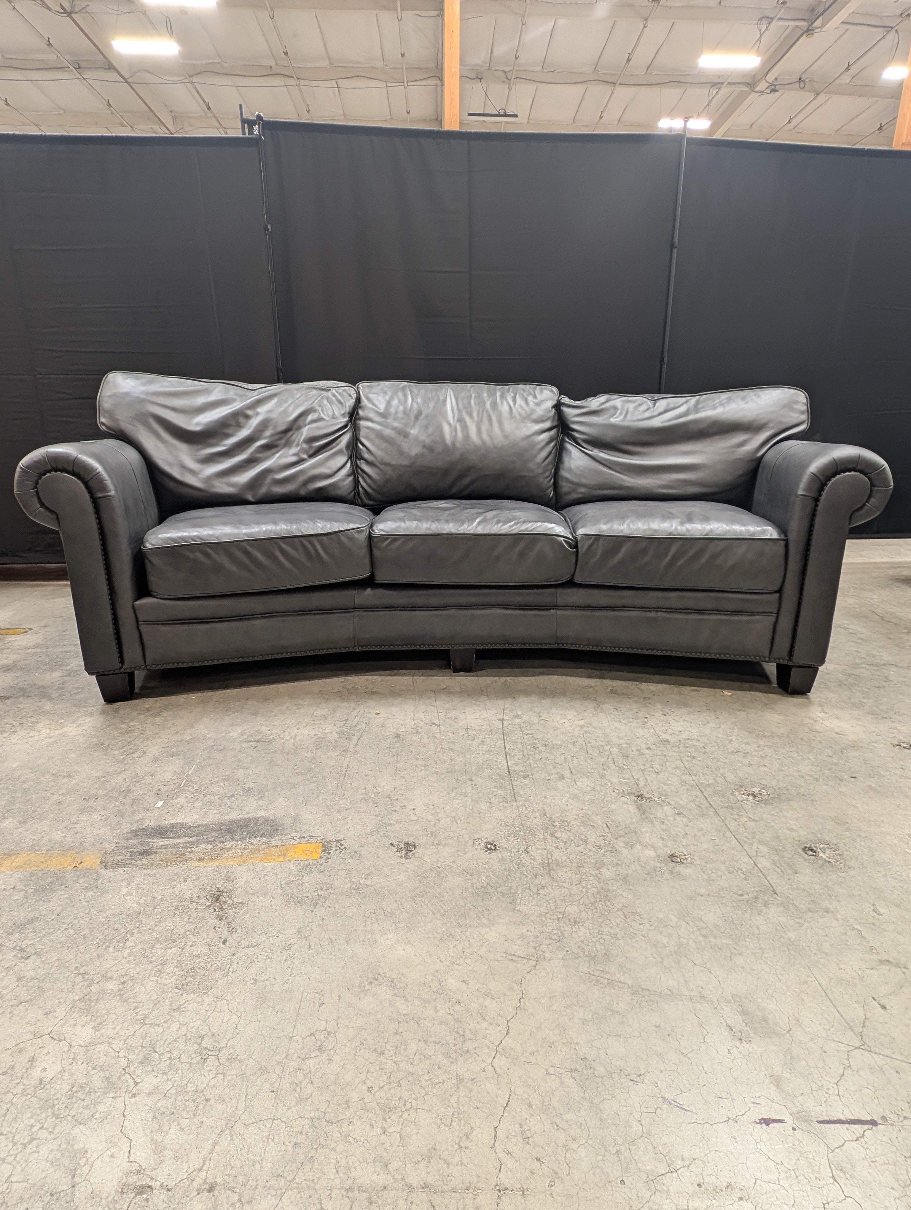 Curved Dark Grey Leather Three-Seater Sofa