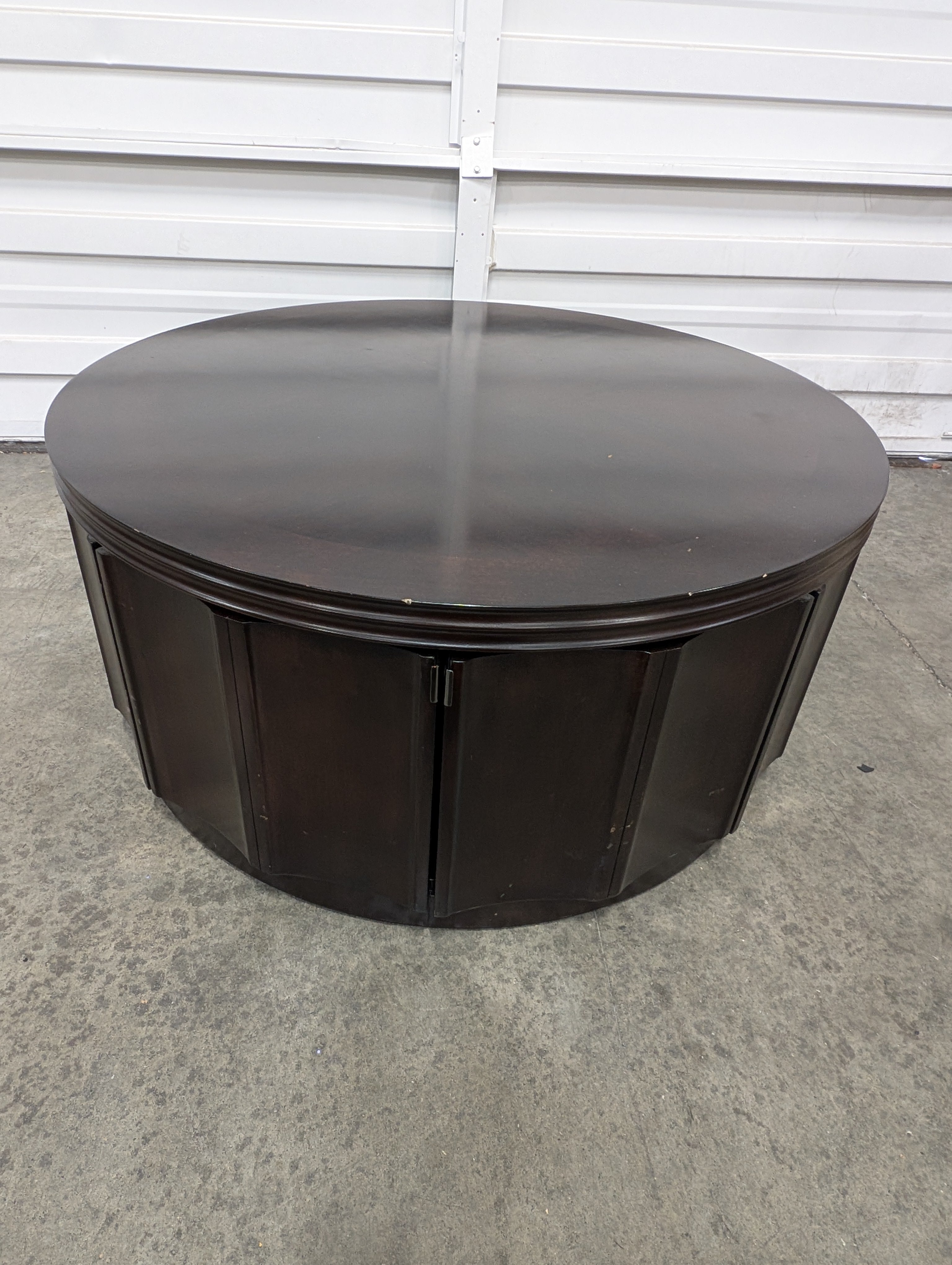 Circular Dark Wood Coffee Table with Paneled Sides