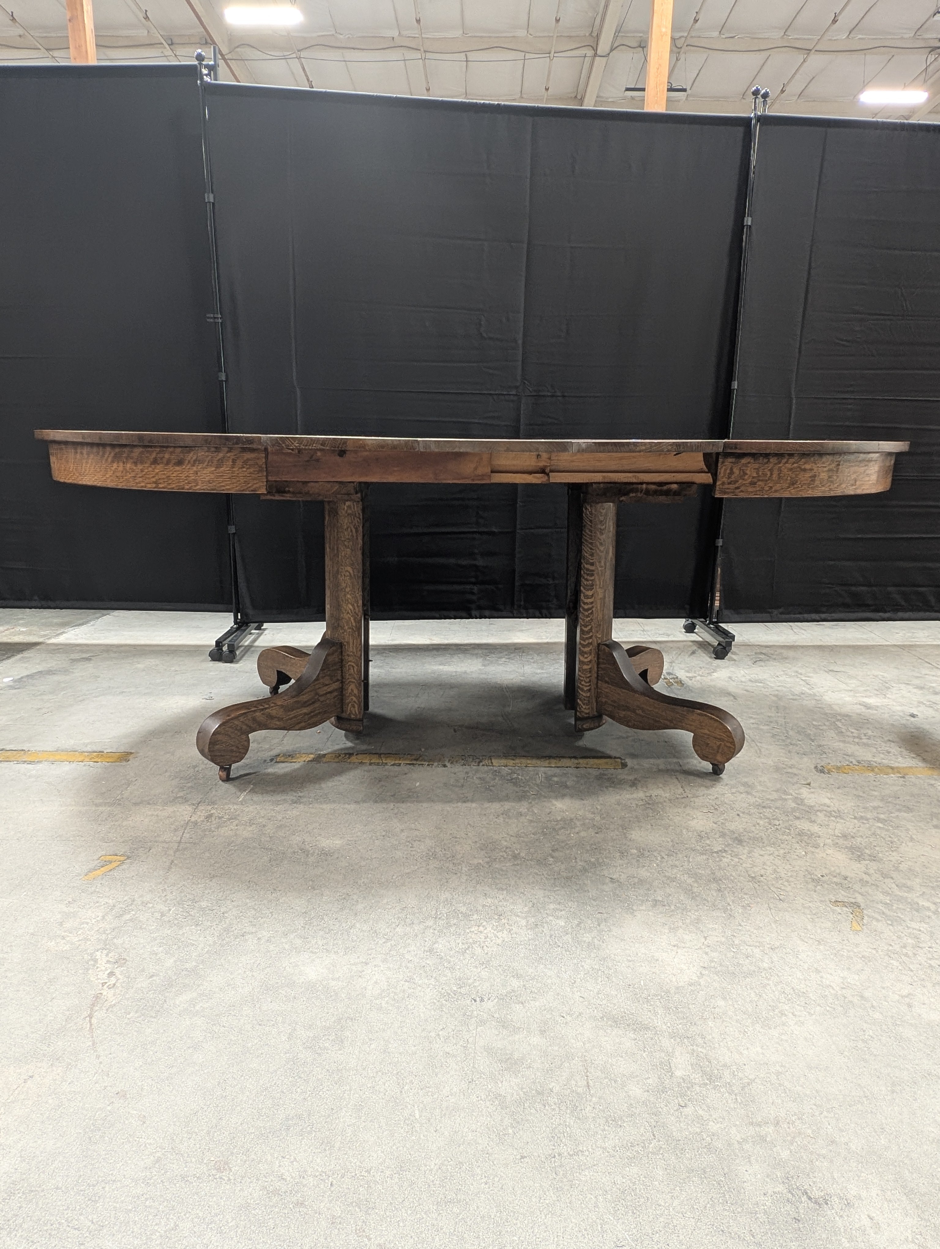 Round Dark Stained Wood Pedestal Dining Table