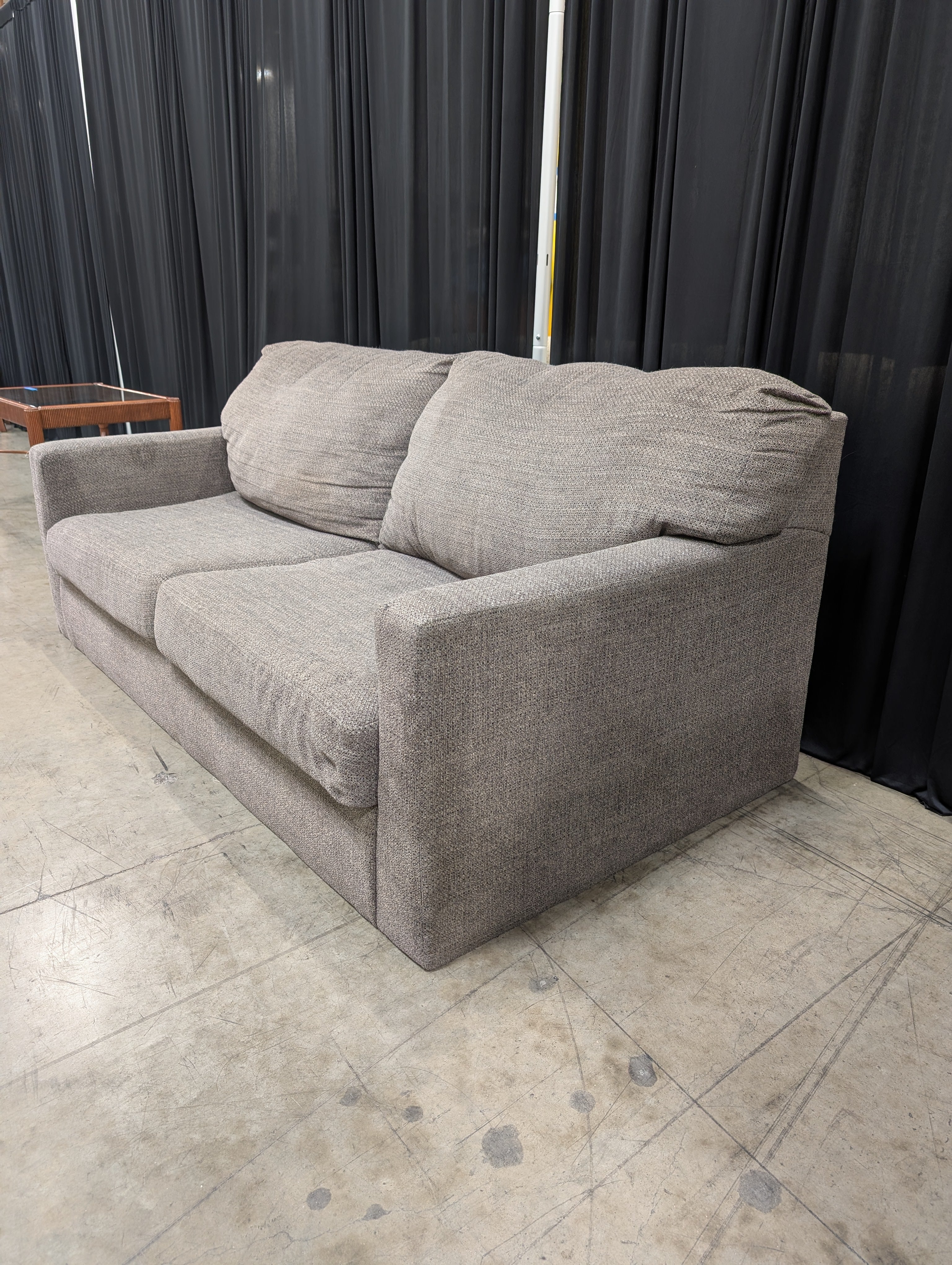 Grey Textured Fabric Two-Seater Couch with Track Arms