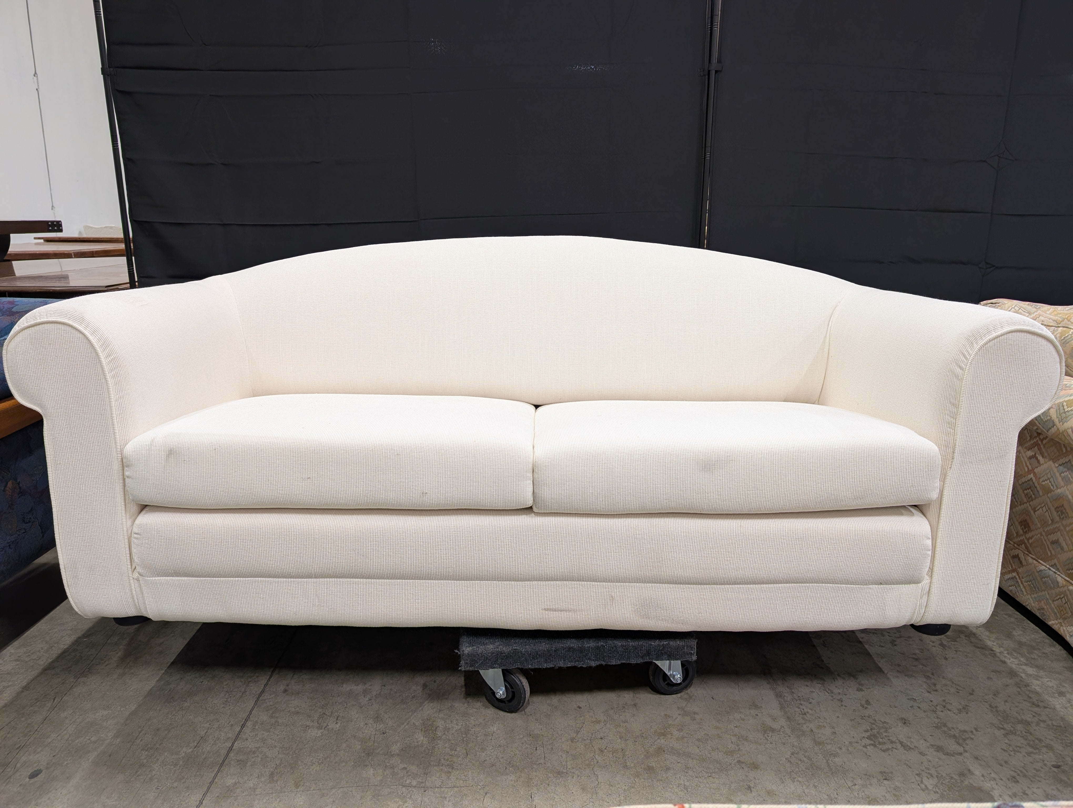 Cream-Colored Two-Seater Sofa